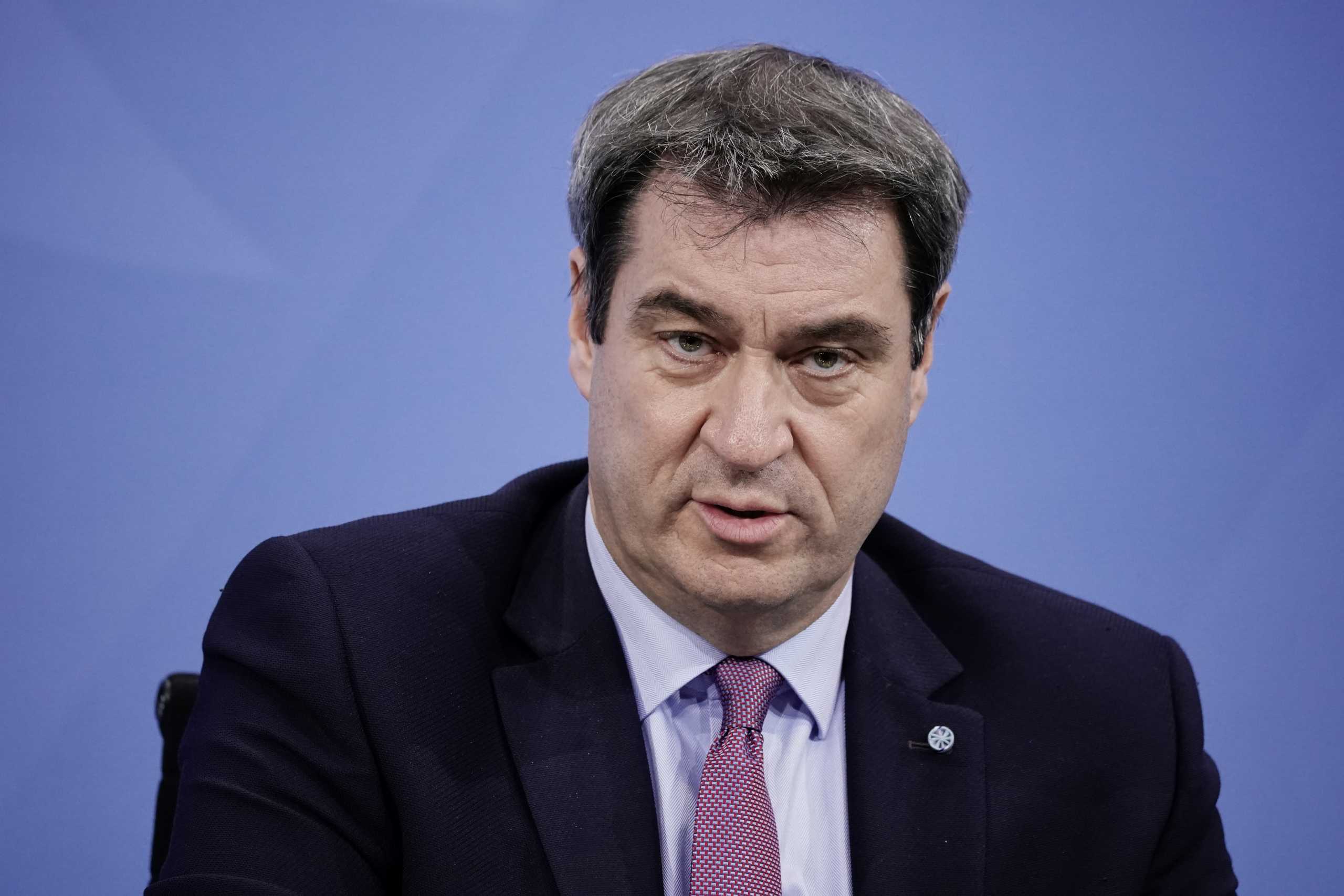 Bavarian State Prime Minister Markus Soeder attends a news conference after talks with state leaders at the Chancellery in Berlin, Germany January 5, 2021.     Michel Kappeler