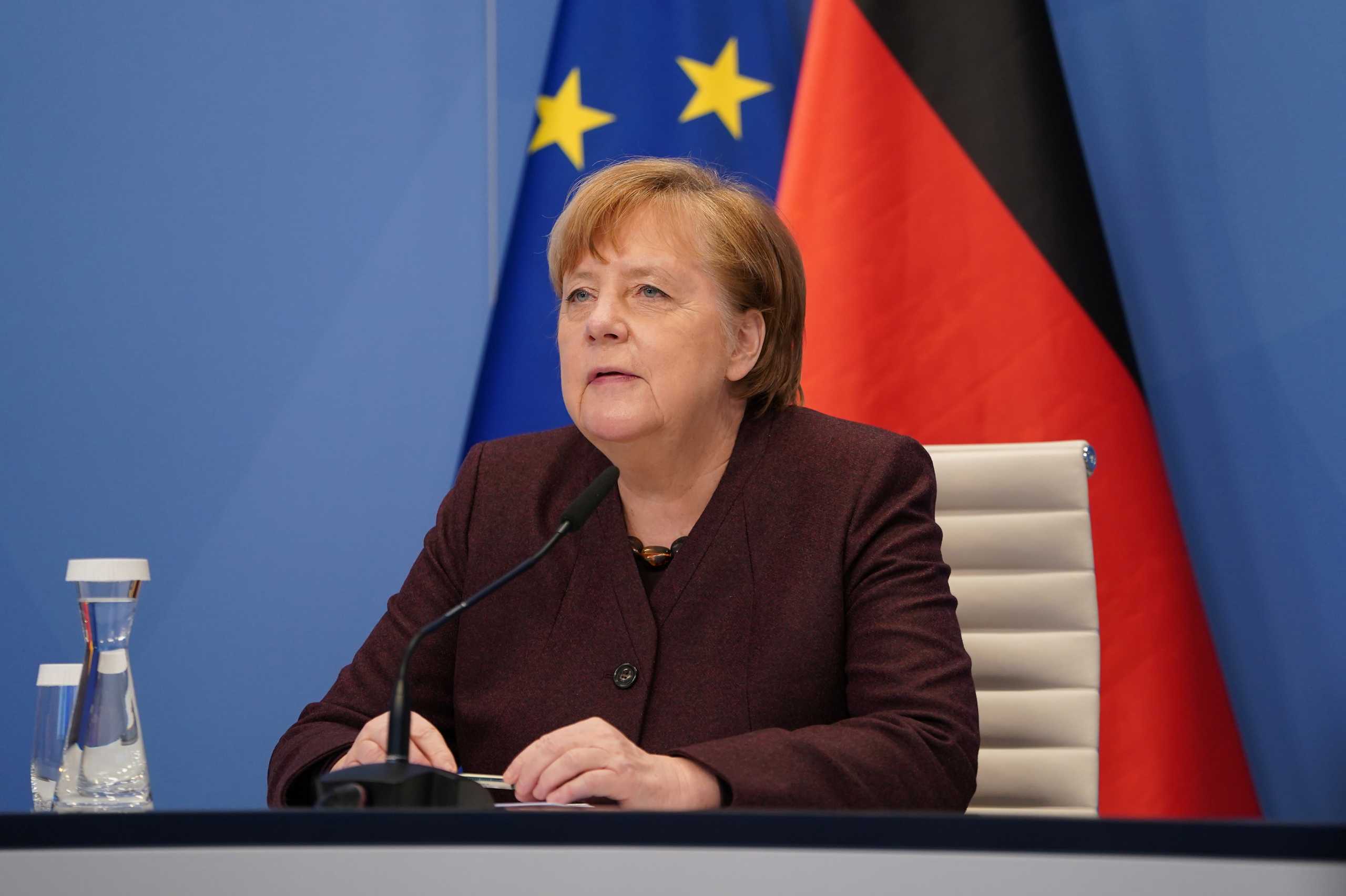 German Chancellor Angela Merkel prepares to speak in a virtual dialogue meeting of the World Economic Forum (WEF) at Davos, from the Chancellery in Berlin, Germany January 26, 2021. Sean Gallup