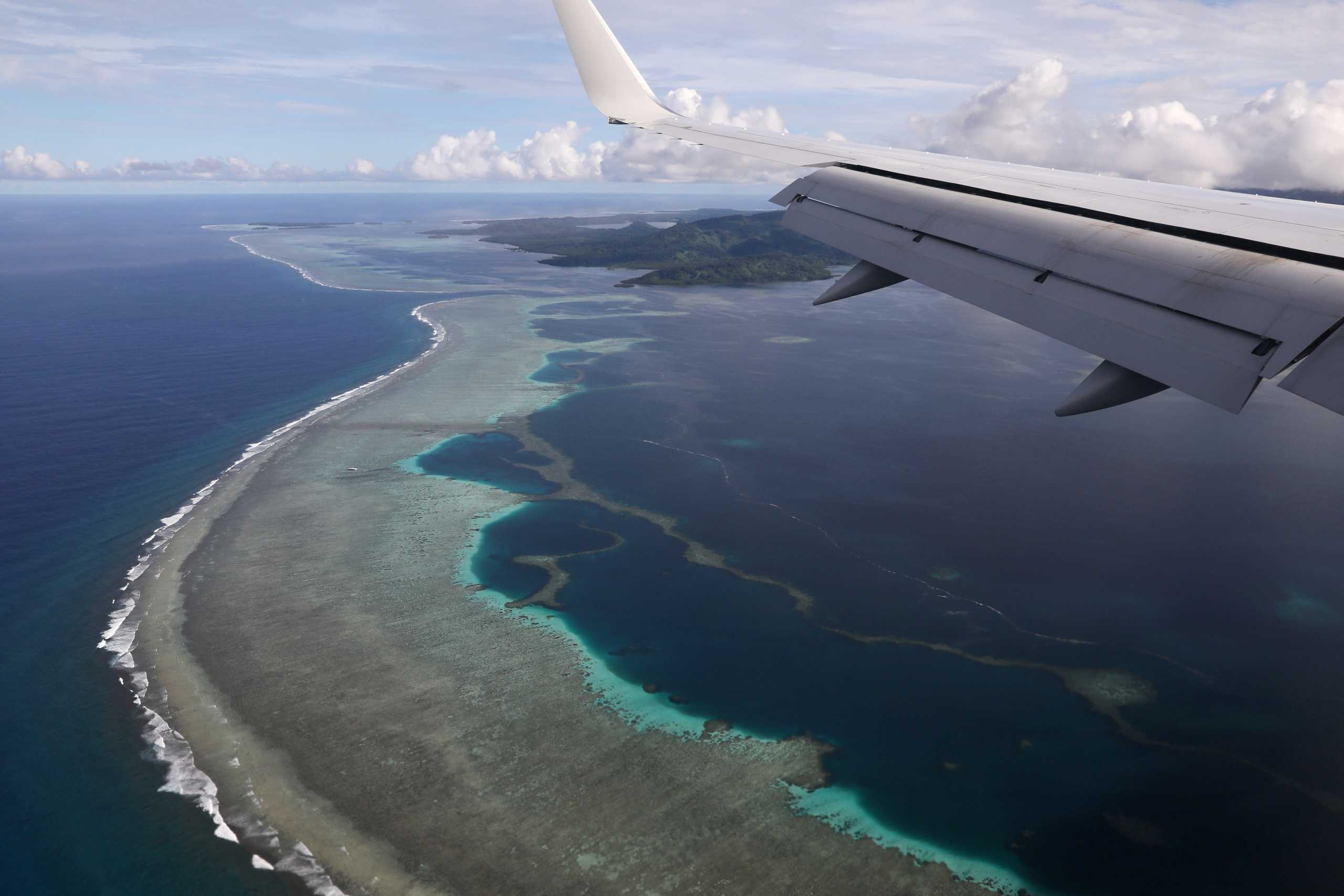 FILE PHOTO: U.S. Secretary of State Mike Pompeo's plane makes its landing approach on Pohnpei International Airport in Kolonia, Federated States of Micronesia August 5, 2019. REUTERS
