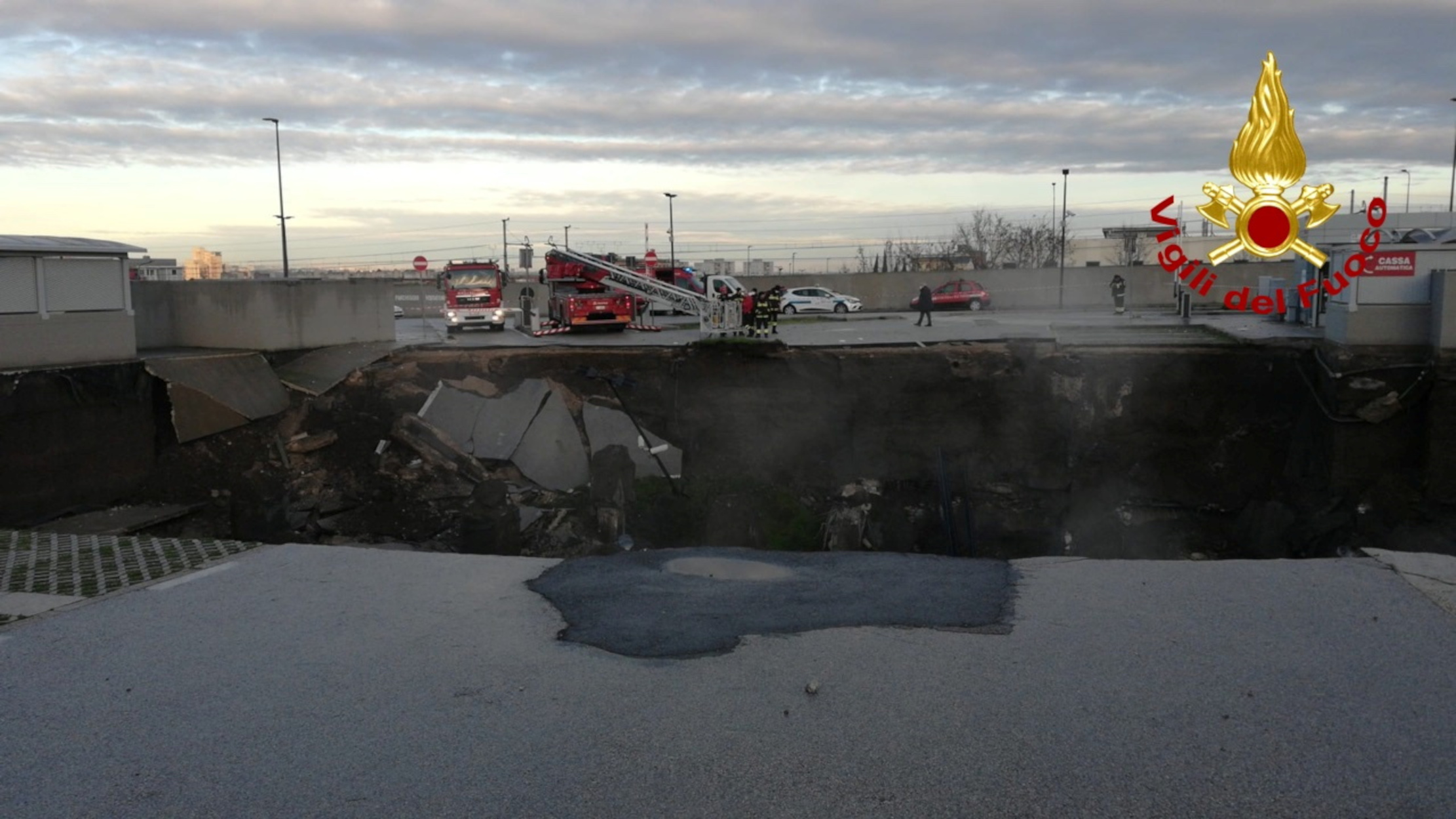 Firefighters attend to a chasm at the Ospedale del Mare car park in Naples, Italy January 8, 2021. Vigili del Fuoco