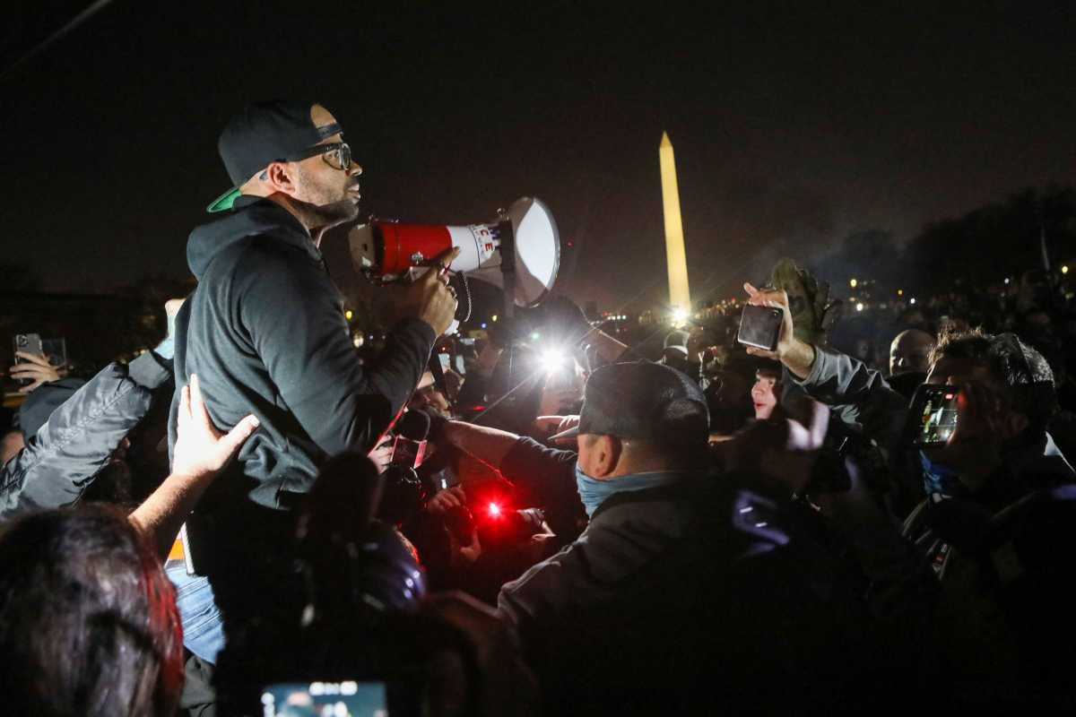 Proud Boys Chairman Enrique Tarrio addresses supporters of U.S. President Donald Trump and other  members of the far-right Proud Boys during a march near the Washington Monument the night before rallies to protest the U.S. presidential election results, in Washington, D.C., U.S., December 11, 2020. REUTERS