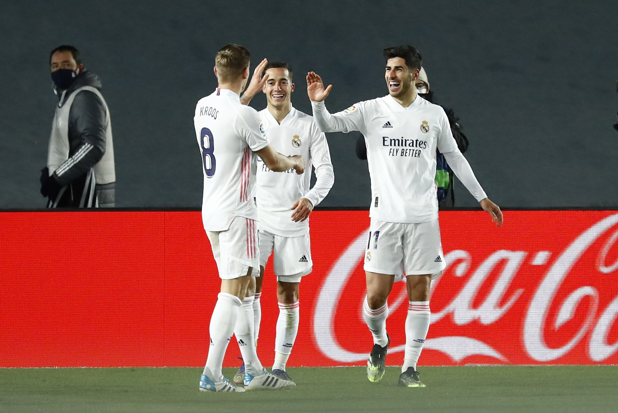 Soccer Football - La Liga Santander - Real Madrid v Celta Vigo - Estadio Alfredo Di Stefano, Madrid, Spain - January 2, 2021 Real Madrid's Marco Asensio celebrates scoring their second goal with teammates REUTERS