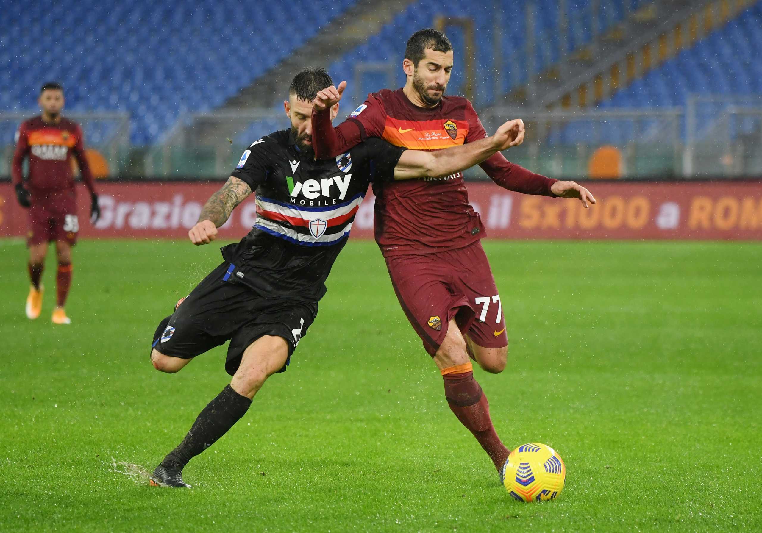 Soccer Football - Serie A - AS Roma v Sampdoria - Stadio Olimpico, Rome, Italy - January 3, 2021 AS Roma's Henrikh Mkhitaryan in action with Sampdoria's Lorenzo Tonelli REUTERS