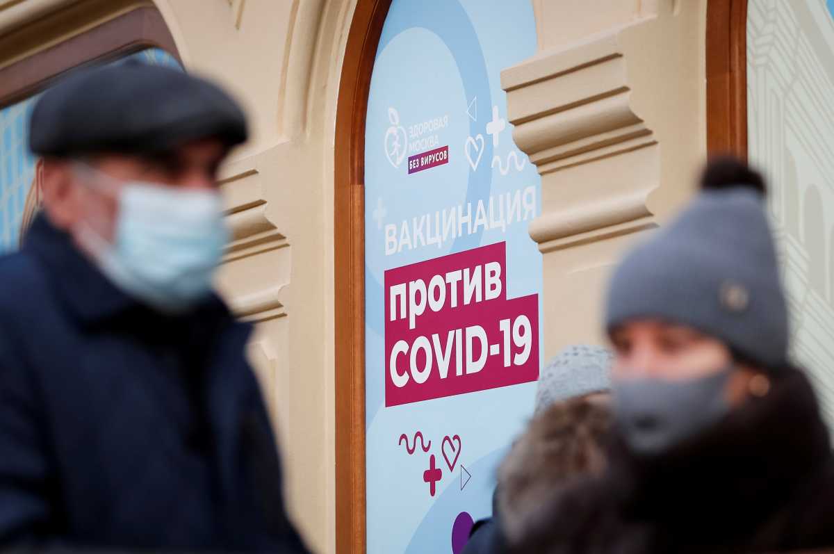 FILE PHOTO: People are seen outside a vaccination centre in the State Department Store, GUM, amid the outbreak of the coronavirus disease (COVID-19), in central Moscow, Russia January 18, 2021 REUTERS