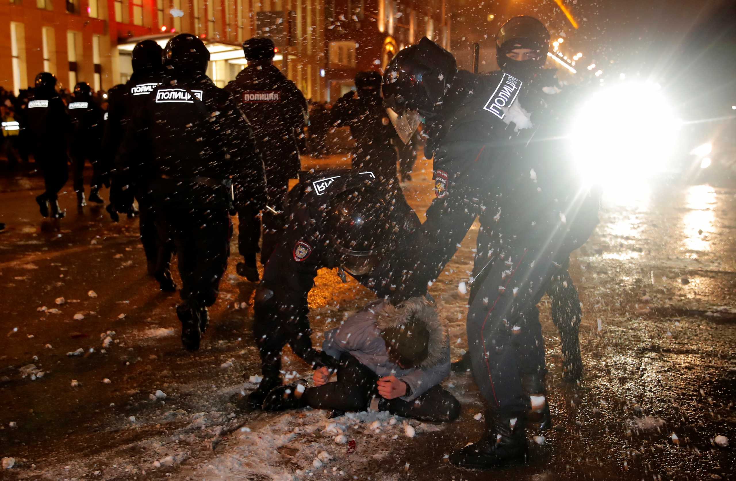 Law enforcement officers detain a man during a rally in support of jailed Russian opposition leader Alexei Navalny in Moscow, Russia January 23, 2021. REUTERS