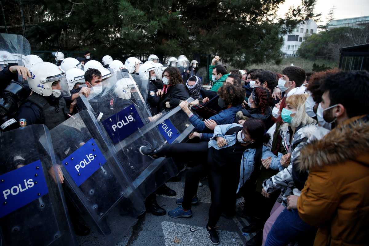 Turkish riot police clash with students of Bogazici University who protest against President Tayyip Erdogan's appointment of a new rector, in Istanbul, Turkey January 4, 2021. REUTERS
