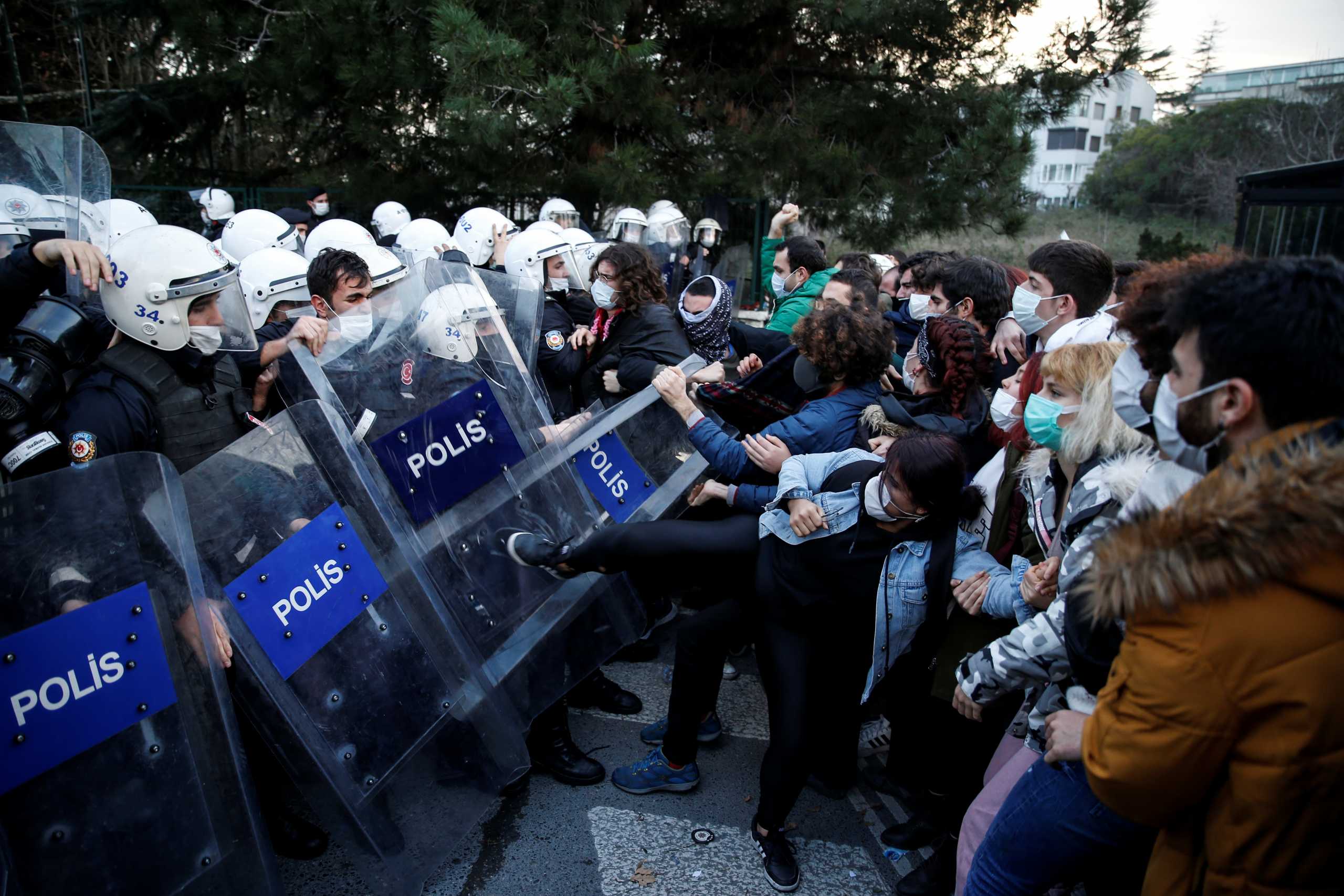 Turkish riot police clash with students of Bogazici University who protest against President Tayyip Erdogan's appointment of a new rector, in Istanbul, Turkey January 4, 2021. REUTERS