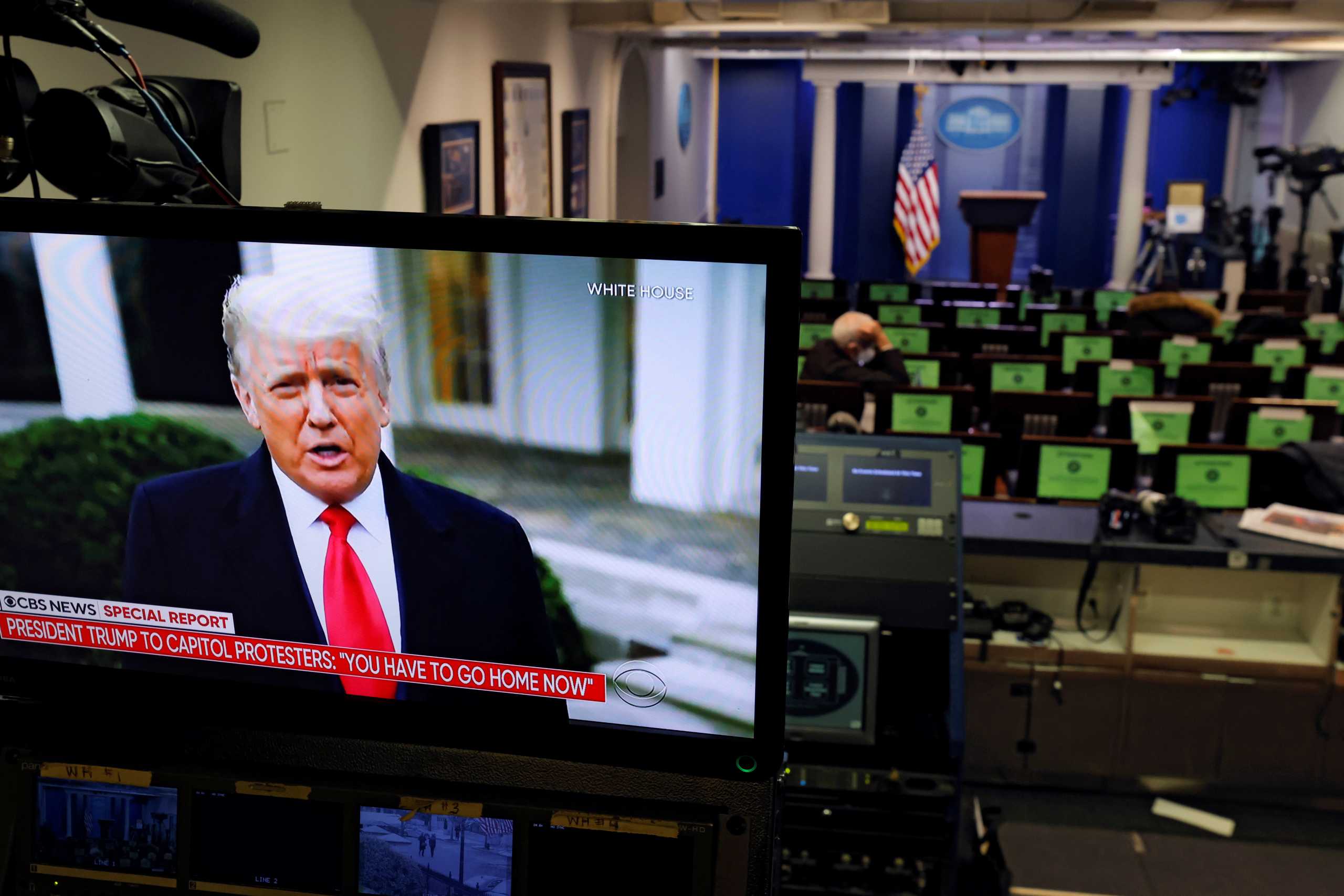 U.S. President Donald Trump is seen making remarks on a television monitor from the White House Briefing Room, after his supporters interrupted the certification by the U.S. Congress of the results of the 2020 U.S. presidential election at the Washington Capitol, in Washington, U.S., January 6, 2021. REUTERS
