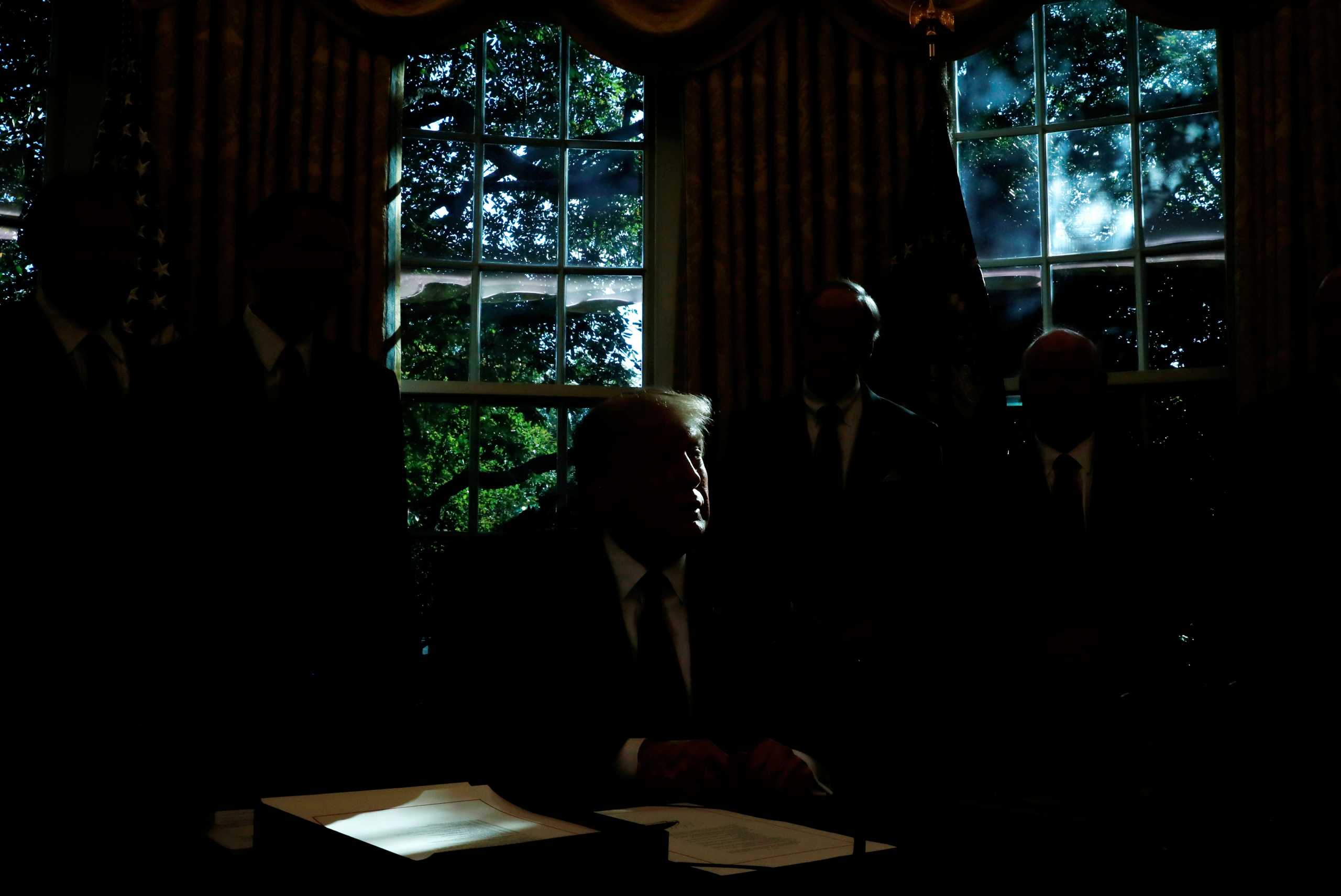 FILE PHOTO: U.S. President Donald Trump speaks during a bill signing event for "America's Water Infrastructure Act of 2018" in the Oval Office at the White House in Washington, U.S., October 23, 2018. REUTERS