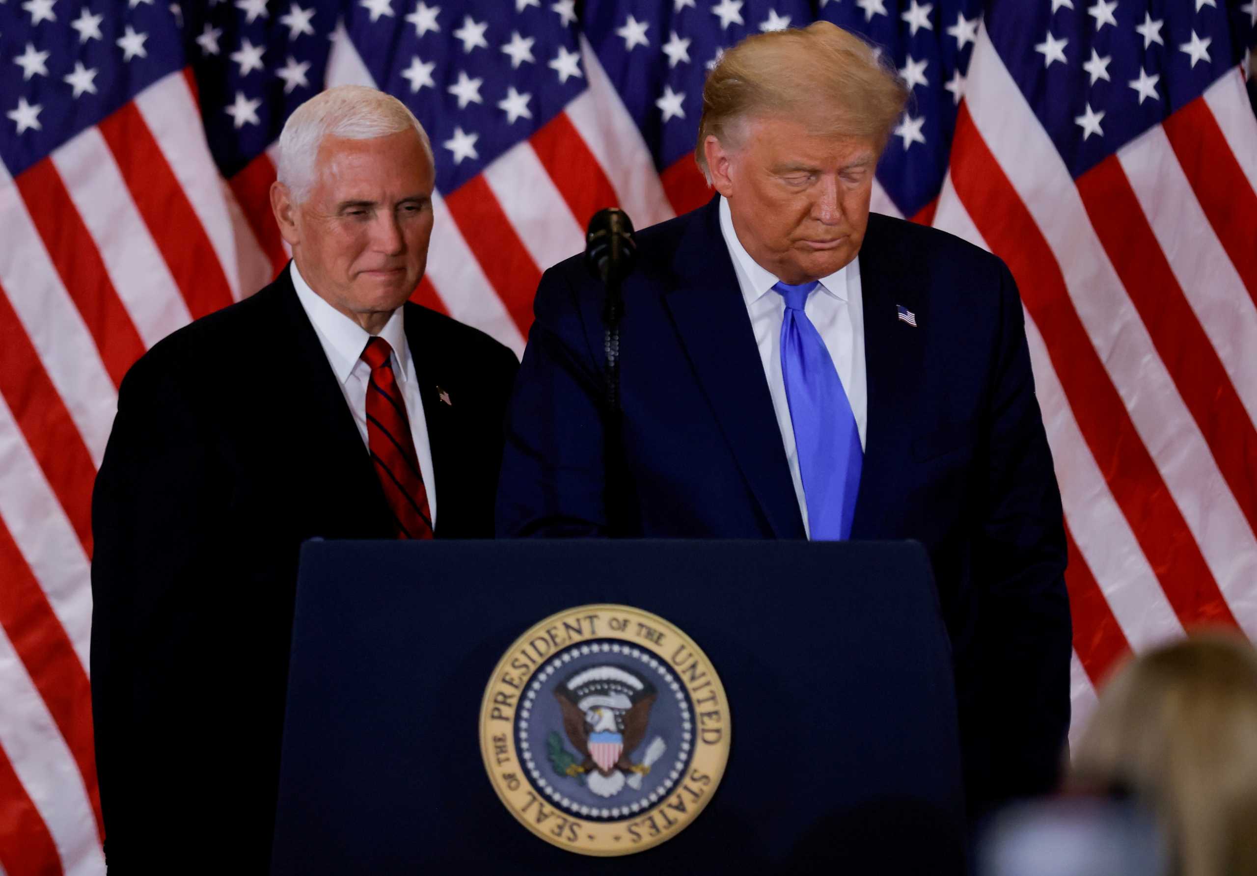 FILE PHOTO: U.S. President Donald Trump and Vice President Mike Pence stand while making remarks about early results from the 2020 U.S. presidential election in the East Room of the White House in Washington, U.S., November 4, 2020. REUTERS