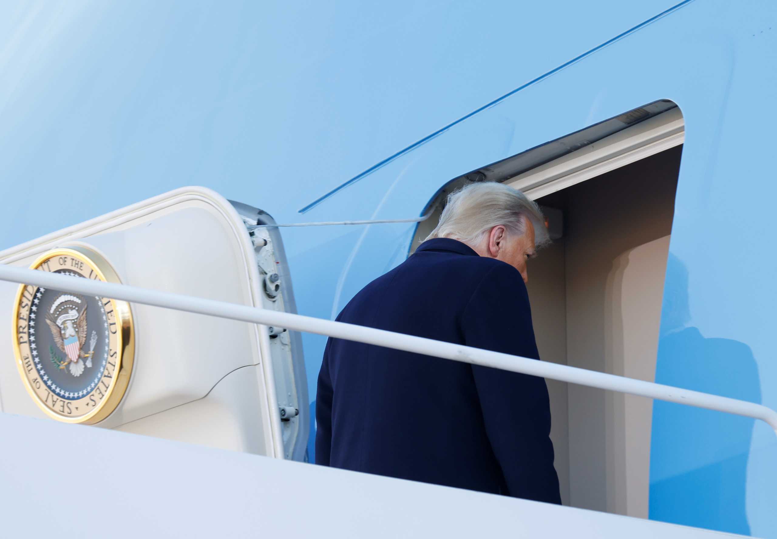 U.S. President Donald Trump boards Air Force One at Joint Base Andrews, Maryland, U.S., January 20, 2021. REUTERS