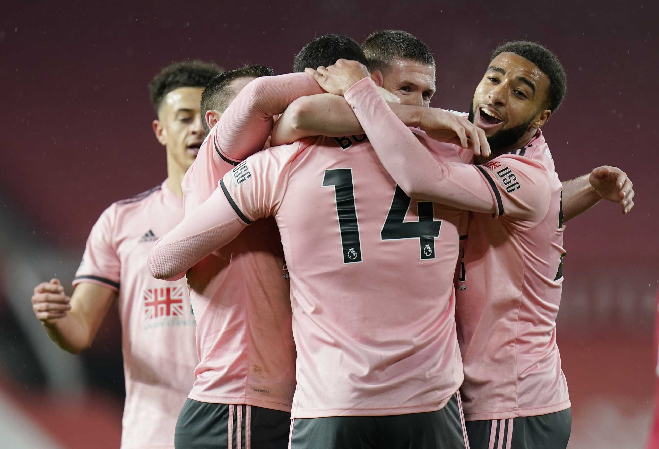 Soccer Football - Premier League - Manchester United v Sheffield United - Old Trafford, Manchester, Britain - January 27, 2021 Sheffield United's Oliver Burke celebrates scoring their second goal with teammates Pool via REUTERS
