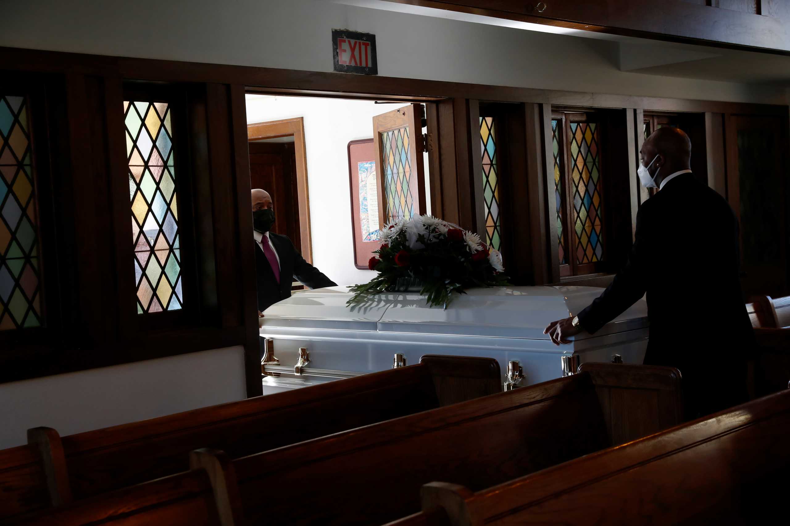 The casket for Florence Bolton, a coronavirus disease (COVID-19) positive patient that died on November 2nd at Roseland Community Hospital, is moved after her funeral at Zion Evangelical Lutheran Church on the South Side of Chicago, Illinois, U.S., December 9, 2020.  Picture taken December 9, 2020. REUTERS