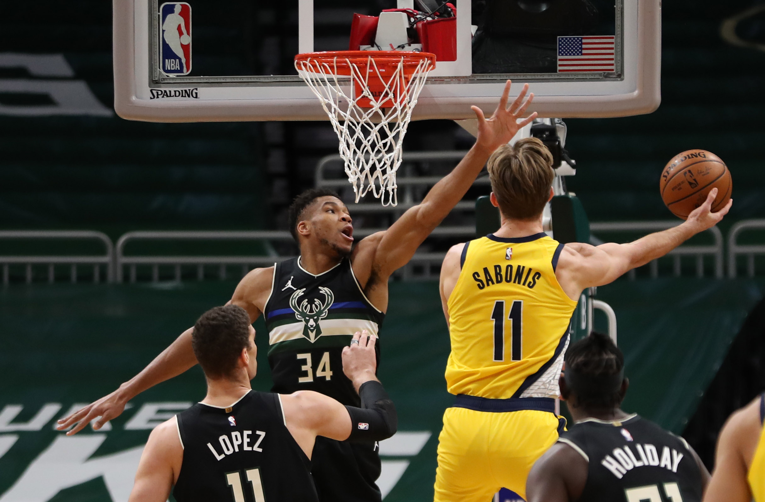 Feb 3, 2021; Milwaukee, WI, USA;  Indiana Pacers forward Domantas Sabonis (11) shoots against Milwaukee Bucks forward Giannis Antetokounmpo (34) at the Bradley Center.  Mandatory Credit: Nick Monroe