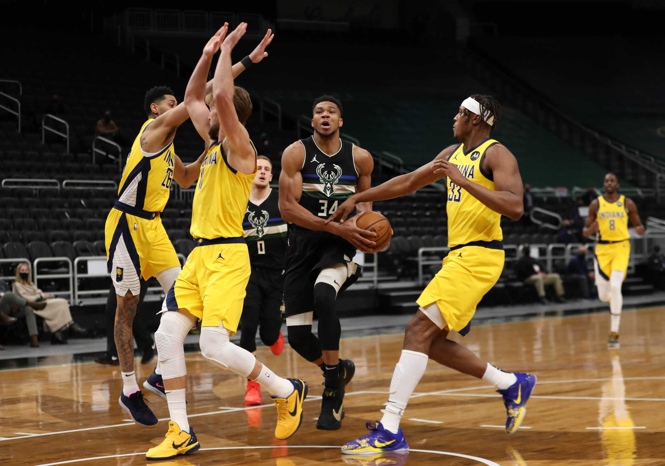 Feb 3, 2021; Milwaukee, WI, USA;  Milwaukee Bucks forward Giannis Antetokounmpo (34) drives to the basket against Indiana Pacers center Myles Turner (33) and forward Domantas Sabonis (11) at the Bradley Center.  Mandatory Credit: Nick Monroe