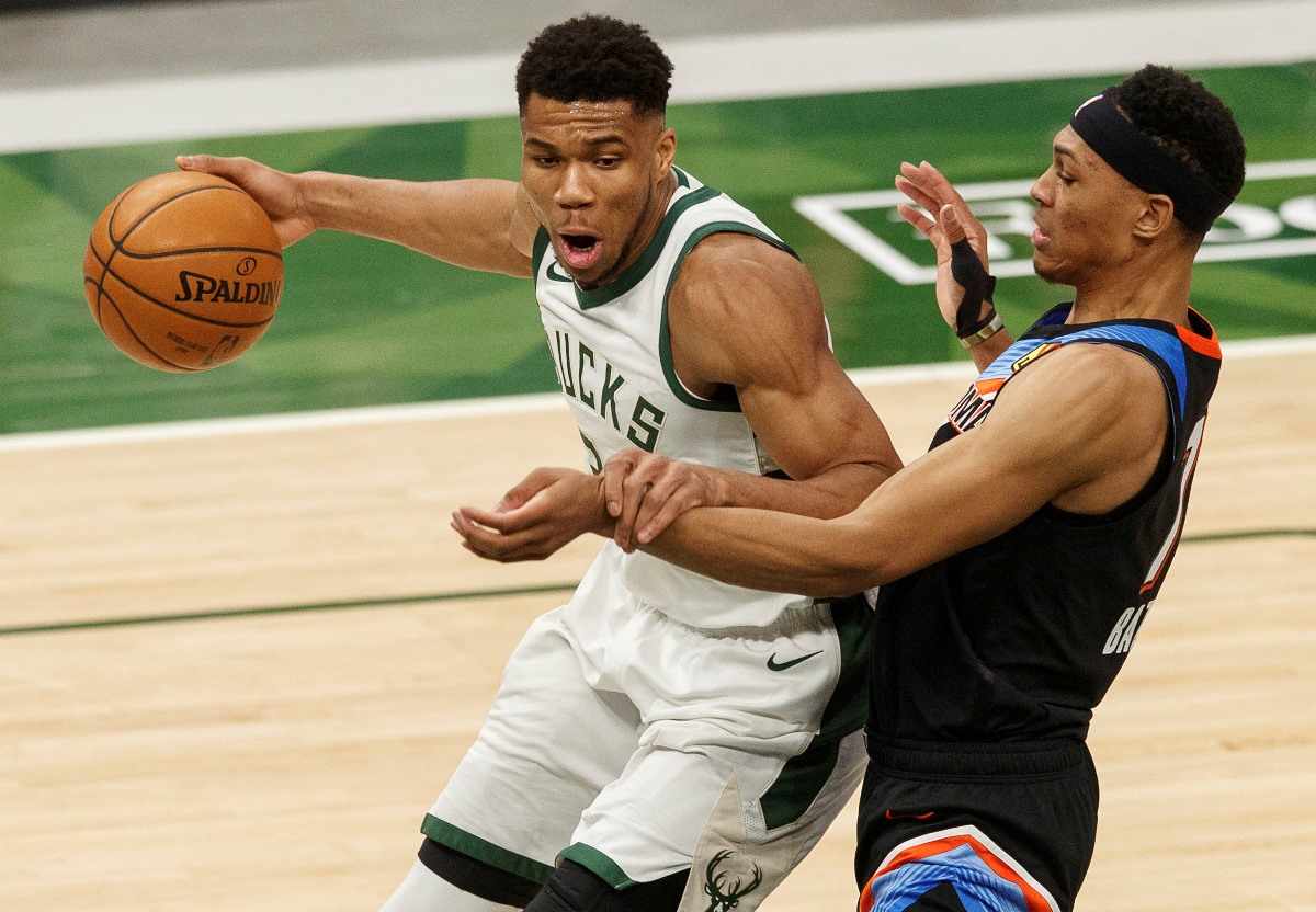 Feb 19, 2021; Milwaukee, Wisconsin, USA;  Milwaukee Bucks forward Giannis Antetokounmpo (34) drives for the basket as Oklahoma City Thunder forward Darius Bazley (7) defends during the third quarter at Fiserv Forum. Mandatory Credit: Jeff Hanisch-USA TODAY Sports