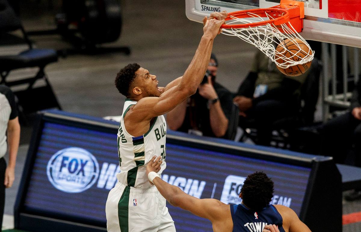 Feb 23, 2021; Milwaukee, Wisconsin, USA;  Milwaukee Bucks forward Giannis Antetokounmpo (34) dunks during the first quarter against the Minnesota Timberwolves tp at Fiserv Forum. Mandatory Credit: Jeff Hanisch-USA TODAY Sports