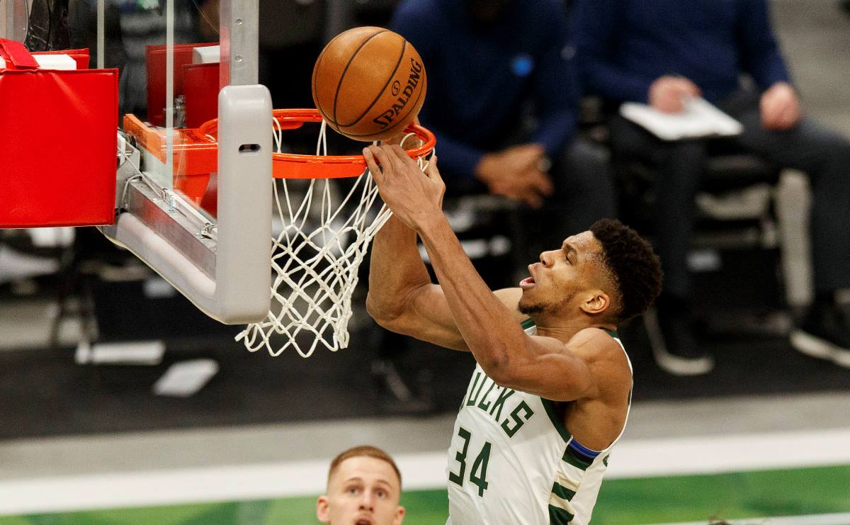 Feb 23, 2021; Milwaukee, Wisconsin, USA;  Milwaukee Bucks forward Giannis Antetokounmpo (34) dunks during the third quarter against the Minnesota Timberwolves at Fiserv Forum. Mandatory Credit: Jeff Hanisch-USA TODAY Sports