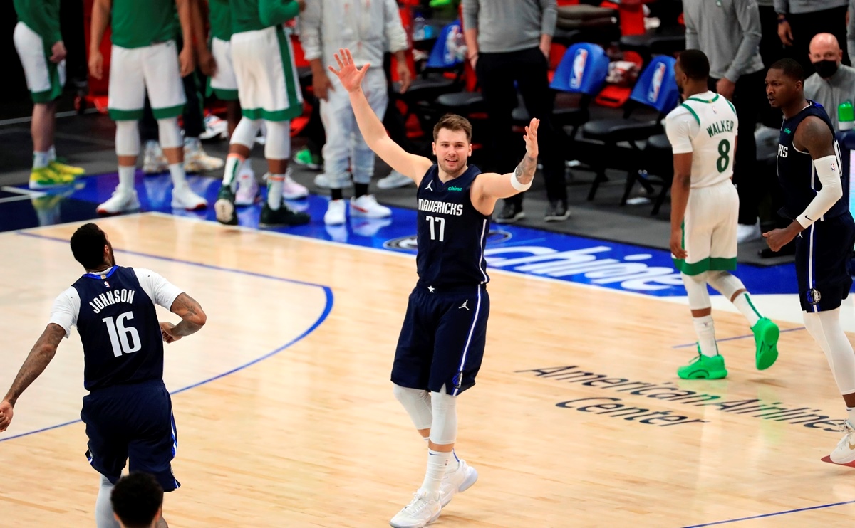 Feb 23, 2021; Dallas, Texas, USA;  Dallas Mavericks guard Luka Doncic (77) celebrates after hitting the game-winning against the Boston Celtics during the fourth quarter at American Airlines Center. Mandatory Credit: Kevin Jairaj-USA TODAY Sports