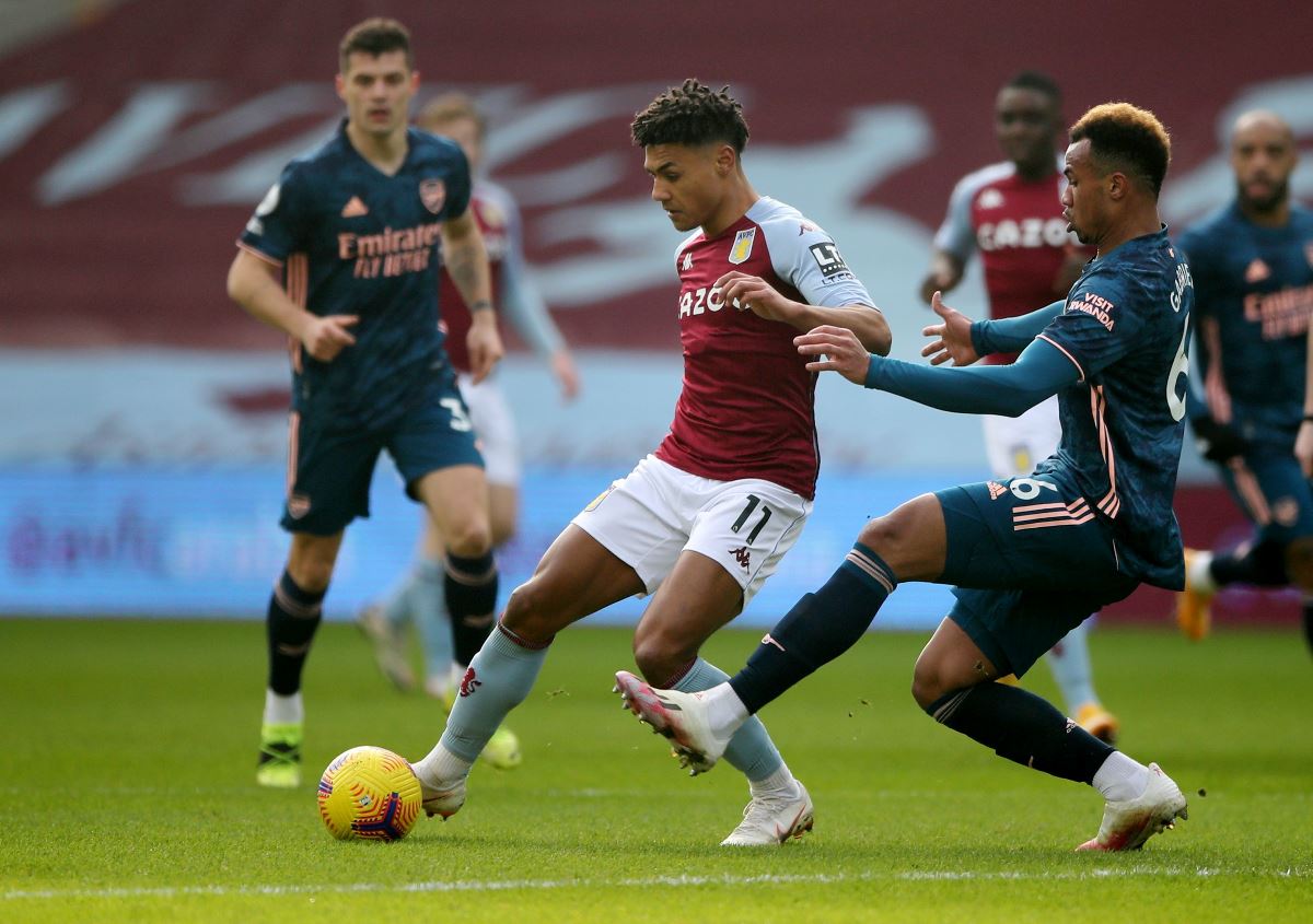 Soccer Football - Premier League - Aston Villa v Arsenal - Villa Park, Birmingham, Britain - February 6, 2021 Aston Villa's Ollie Watkins in action with Arsenal's Gabriel Magalhaes Pool via REUTERS