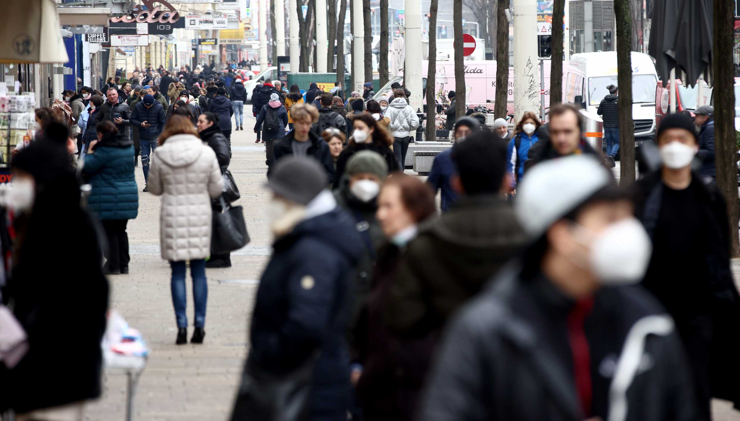 Pedestrians walk down a shopping street after third national lockdown was loosened, as the coronavirus disease (COVID-19) continues in Vienna, Austria February 8, 2021. REUTERS