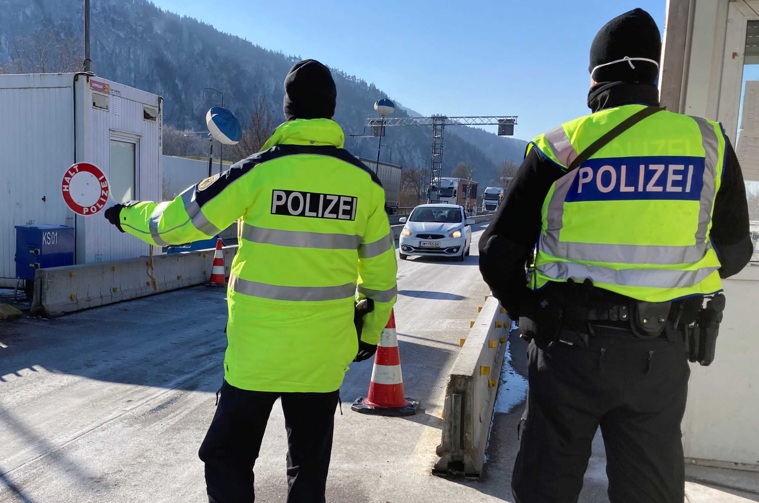 German border police check vehicles arriving from Austria's Tyrol province, after a new law to combat COVID-19 comes into effect, requiring those leaving the region to show a negative test result in response to the EU's biggest outbreak of the so-called South African coronavirus variant, in Kiefersfelden, Germany, February 12, 2021.  REUTERS