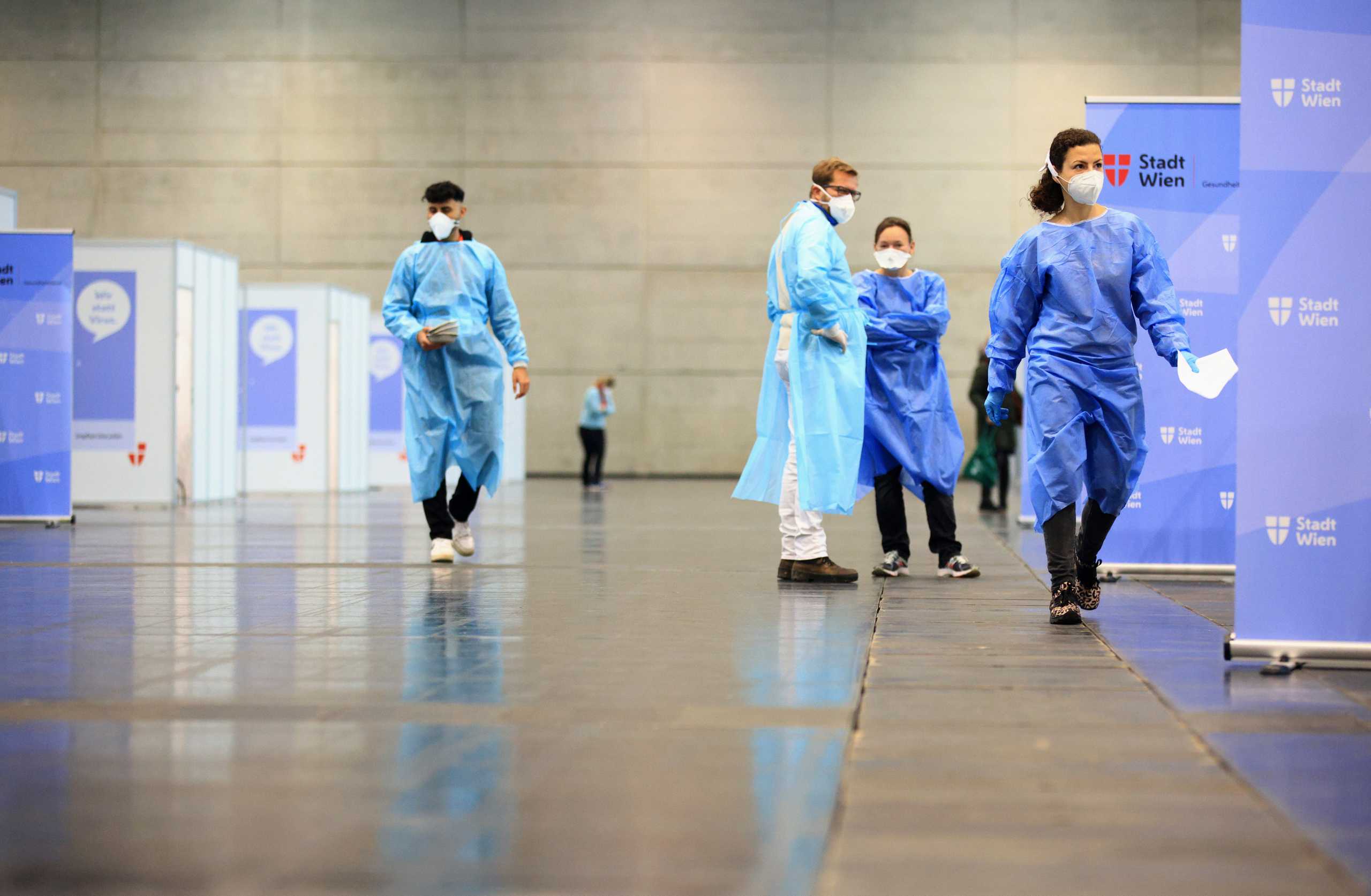 Medical workers wait at a COVID-19 vaccination station during a mass vaccination programme forhealth care workers against the coronavirus disease in Vienna, Austria January 15, 2021. REUTERS