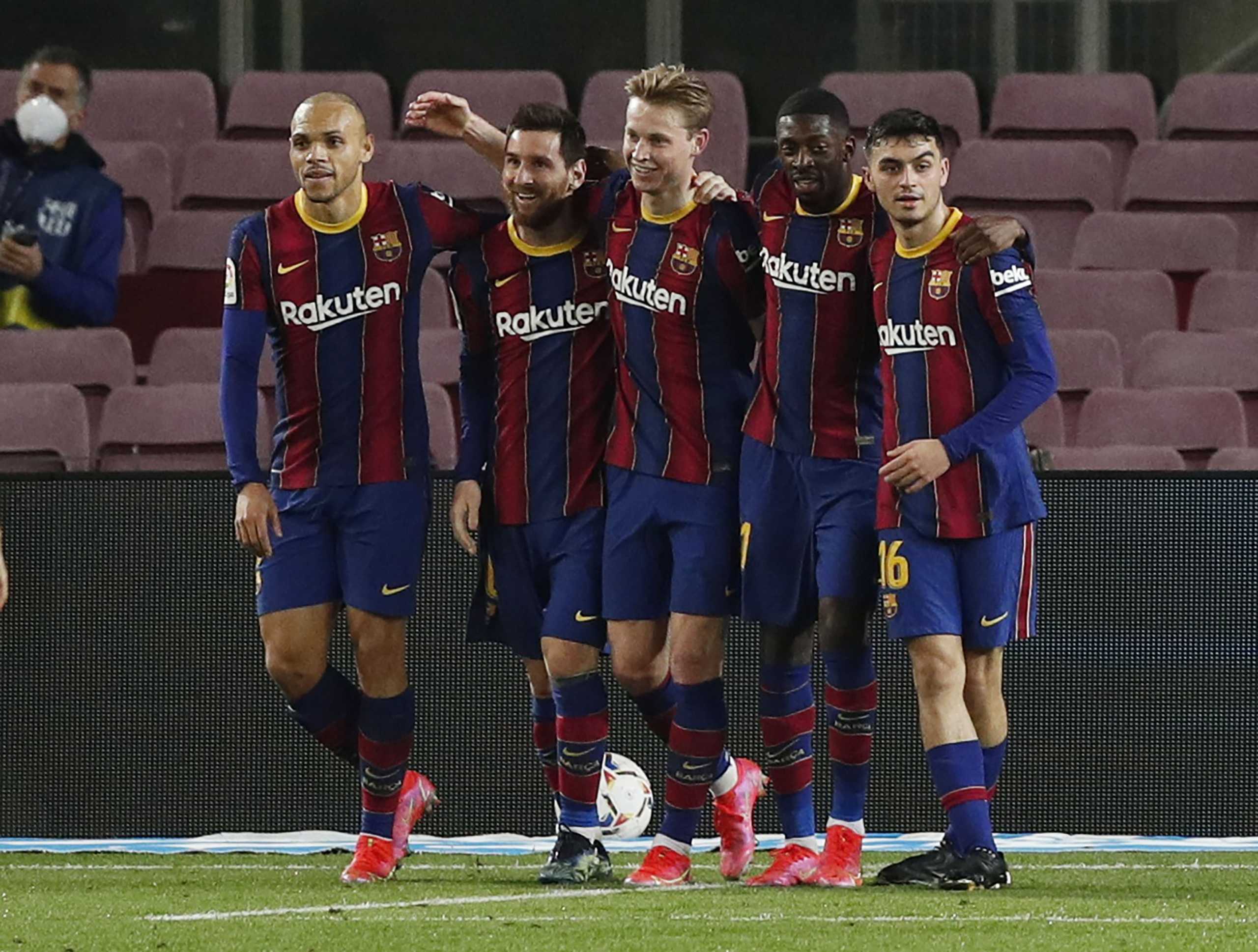 Soccer Football - La Liga Santander - FC Barcelona v Elche - Camp Nou, Barcelona, Spain - February 24, 2021  Barcelona's Lionel Messi celebrates scoring their second goal with teammates REUTERS