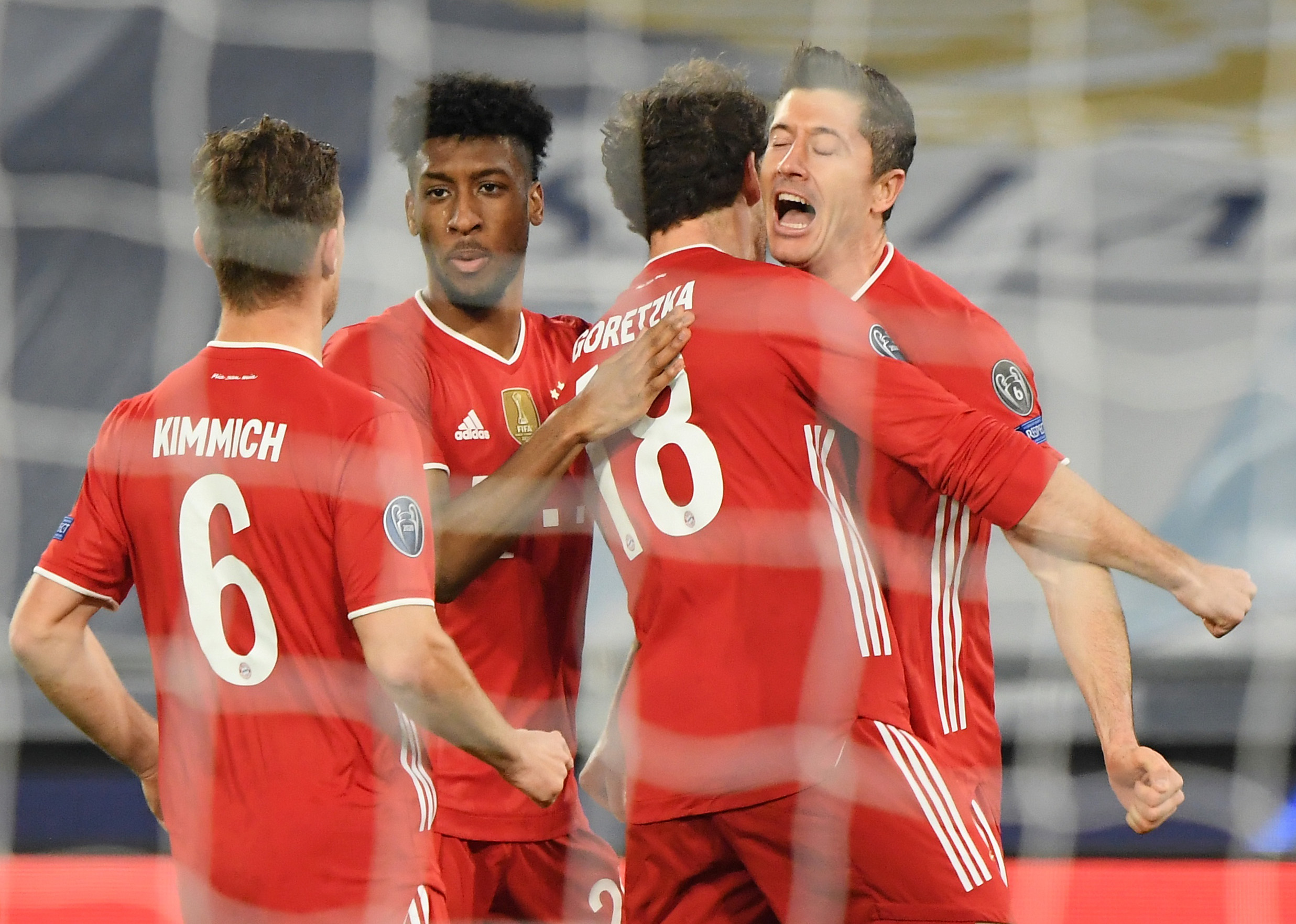 Soccer Football - Champions League - Round of 16 First Leg - Lazio v Bayern Munich - Stadio Olimpico, Rome, Italy - February 23, 2021 Bayern Munich's Robert Lewandowski celebrates scoring their first goal with teammates REUTERS