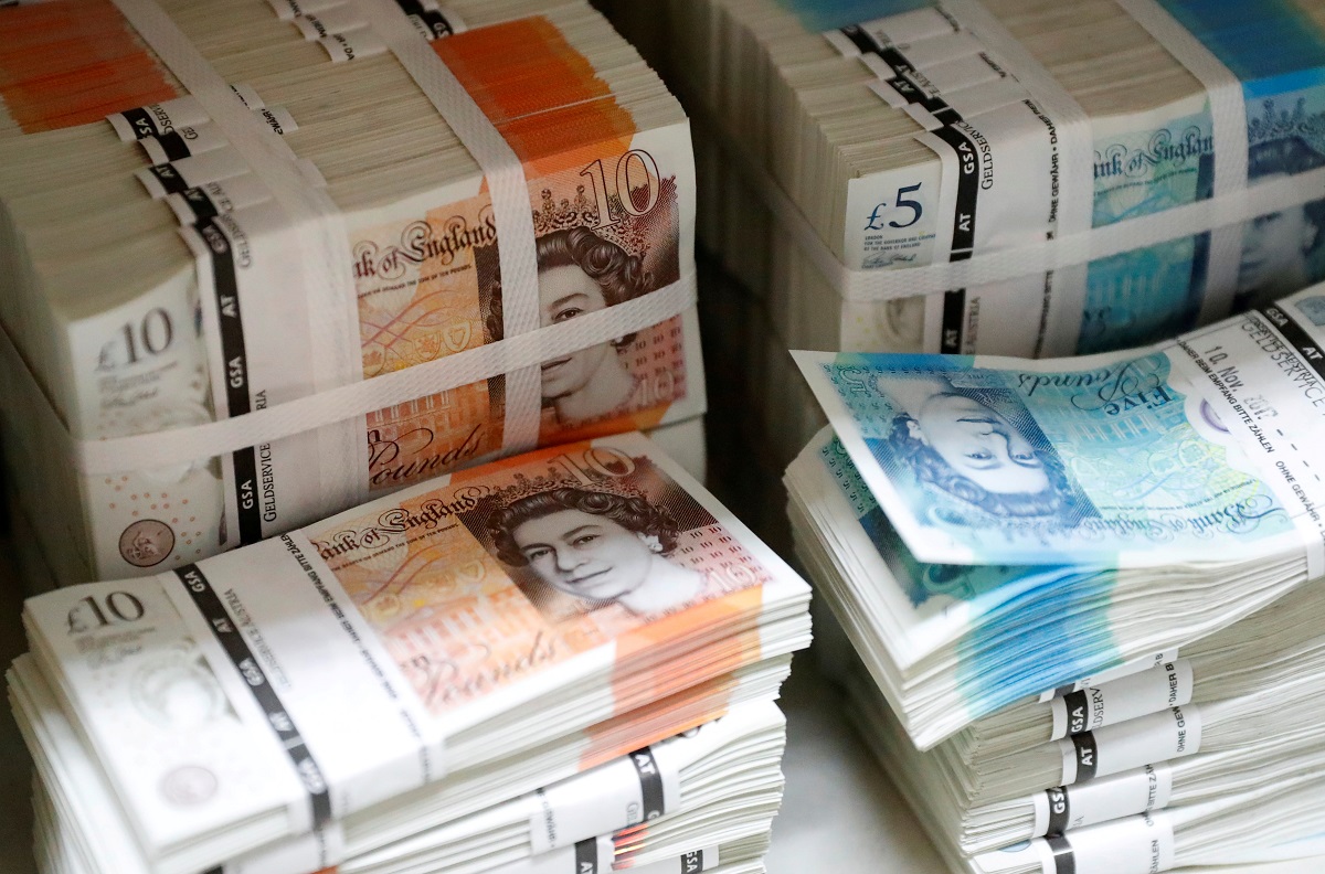 FILE PHOTO: Wads of British Pound Sterling banknotes are stacked in piles at the Money Service Austria company's headquarters in Vienna, Austria, November 16, 2017. REUTERS