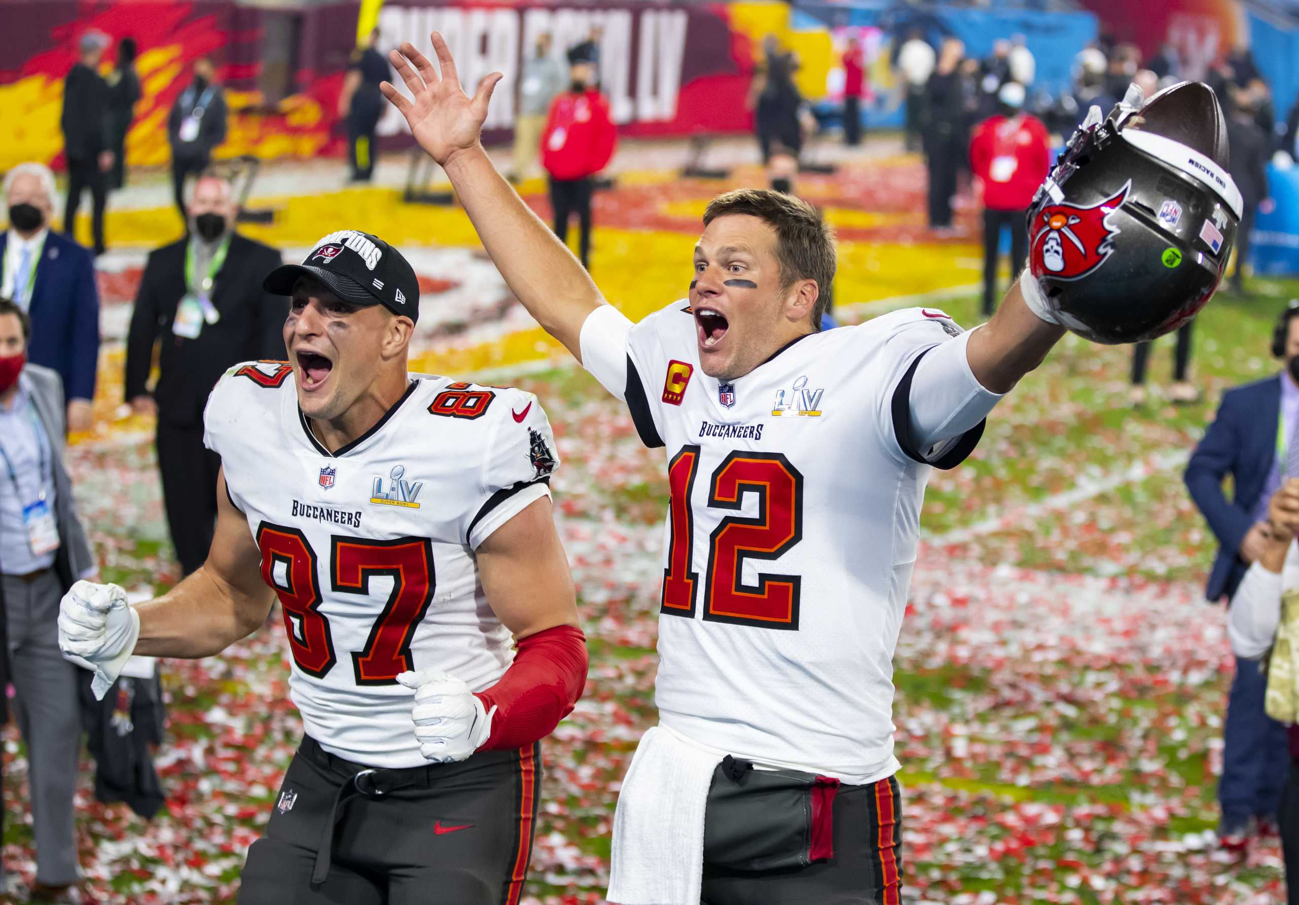 Feb 7, 2021; Tampa, FL, USA;  Tampa Bay Buccaneers quarterback Tom Brady (12) and tight end Rob Gronkowski (87) celebrate after beating the Kansas City Chiefs in Super Bowl LV at Raymond James Stadium.  Mandatory Credit: Mark J. Rebilas-USA TODAY Sports