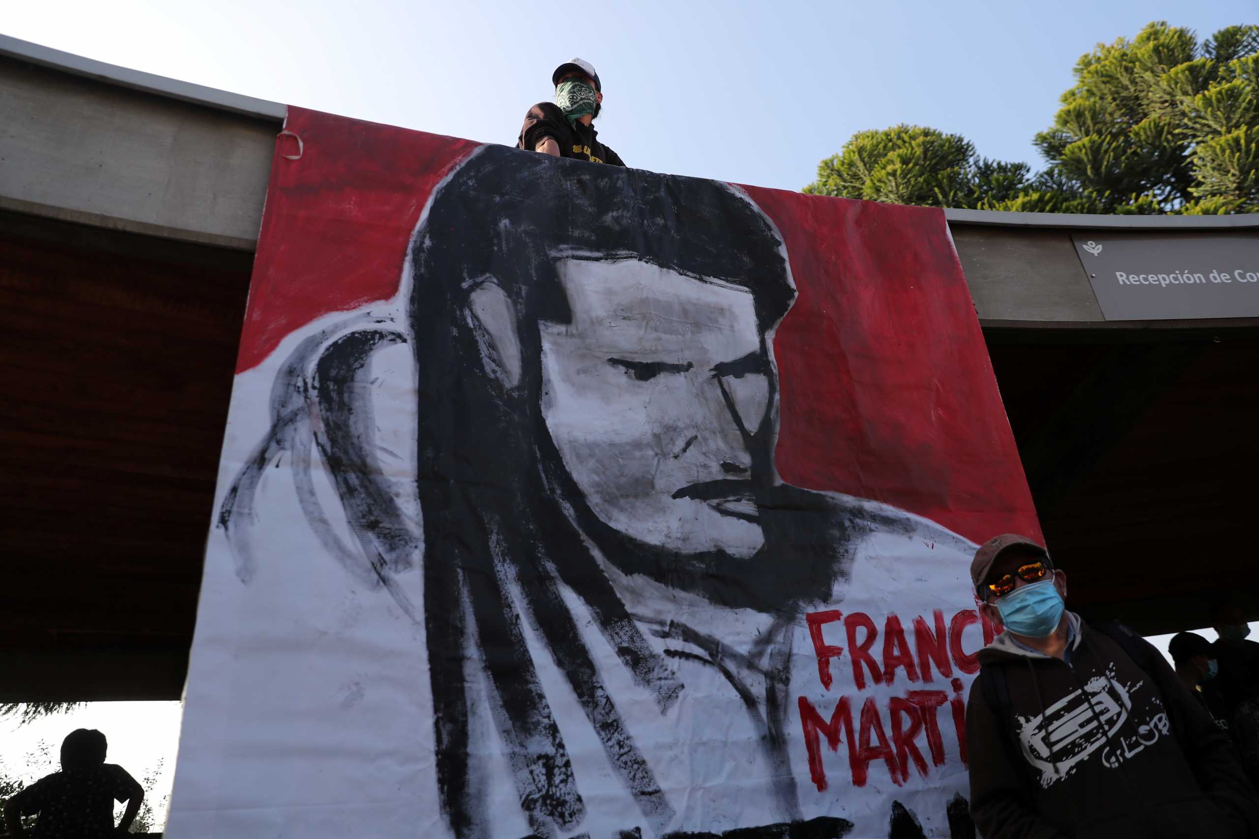 A painting of Francisco Martinez, a young street juggler who was shot dead by a police officer in the southern area of Panguipulli, is seen in Santiago, Chile, February 8, 2021. REUTERS