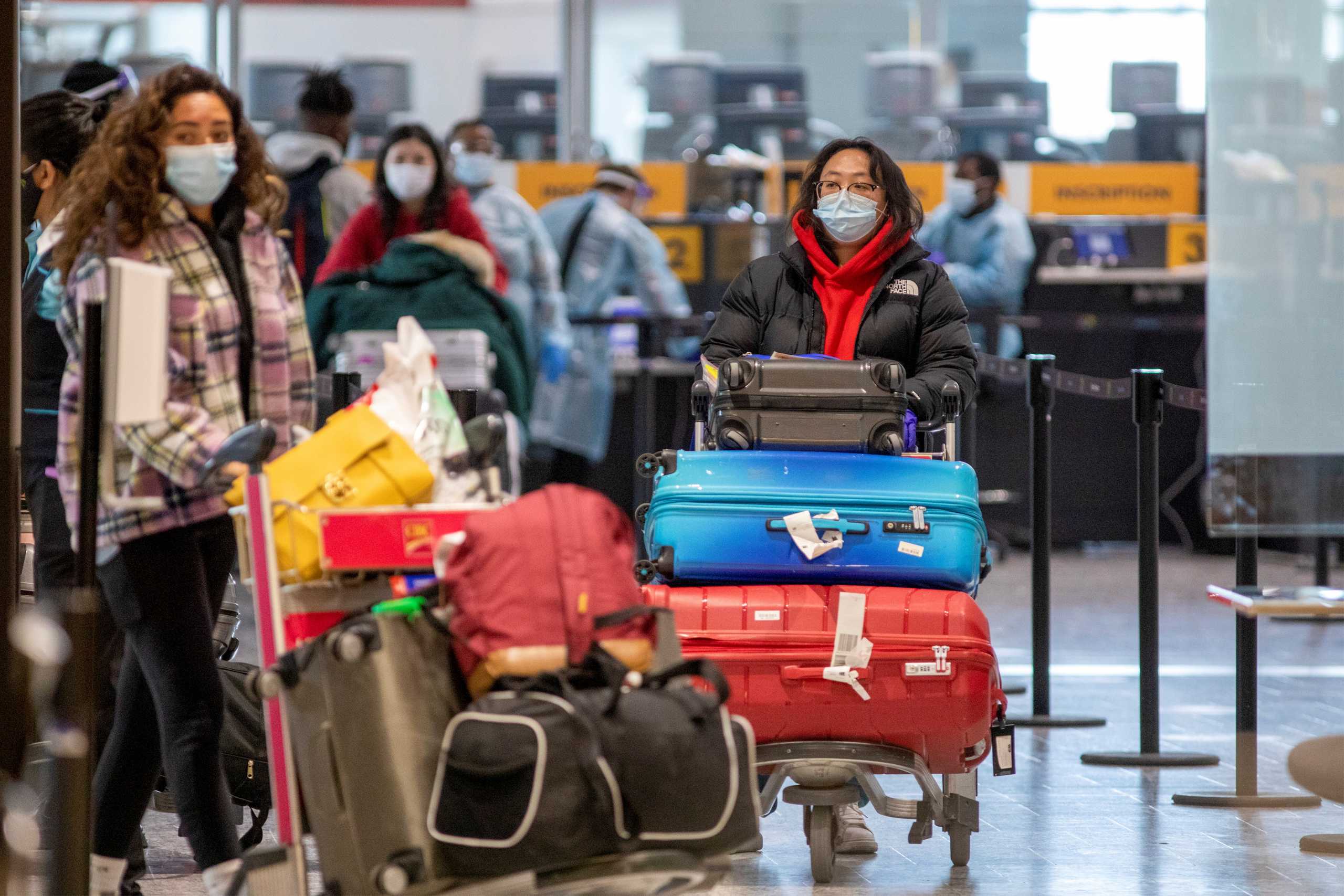 Passengers wait to be tested after they arrive at Toronto's Pearson airport after mandatory coronavirus disease (COVID-19) testing took effect for international arrivals in Mississauga, Ontario, Canada February 15, 2021. REUTERS