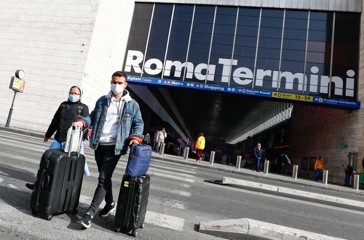 Commuters at Rome's main train station Termini wear masks, amid the coronavirus disease (COVID-19) outbreak, in Rome, Italy, February 22, 2021. REUTERS