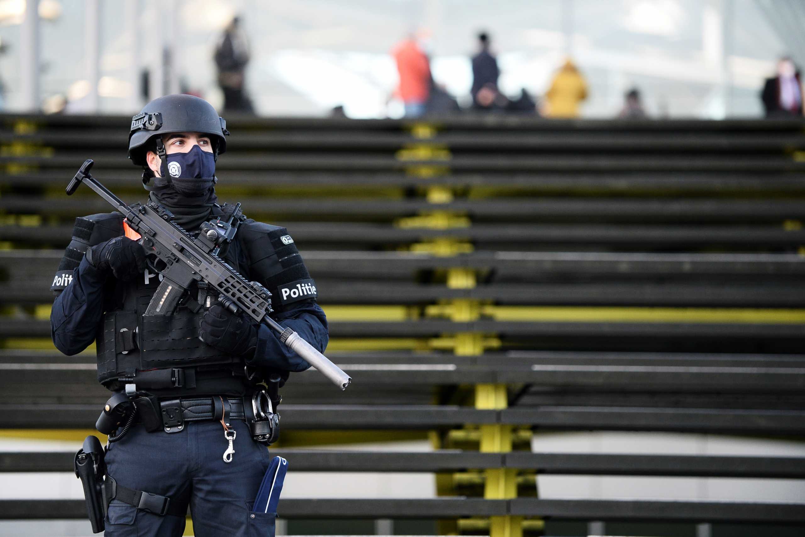 A police officer stands guard outside the court building in Antwerp, Belgium February 4, 2021. REUTERS