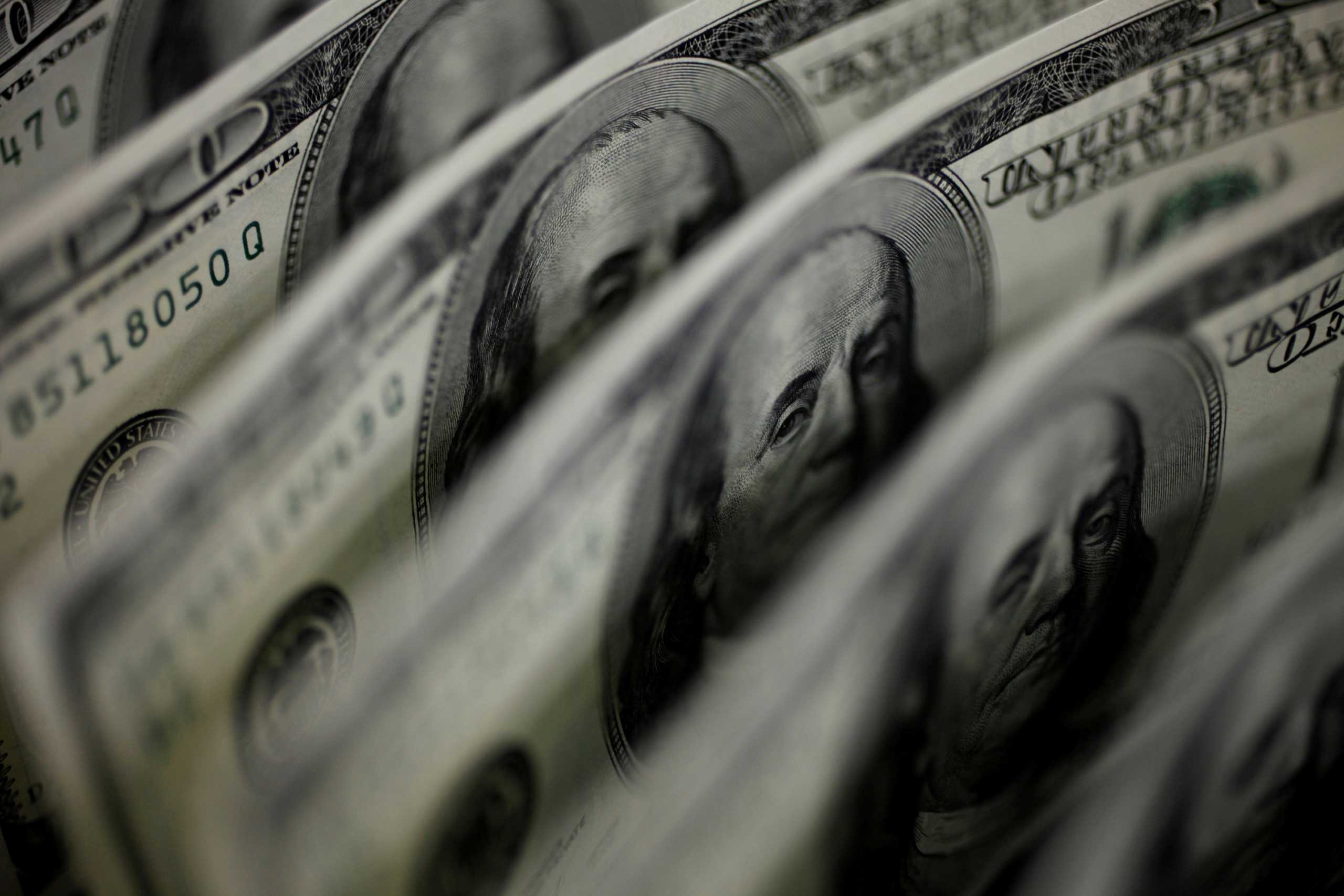 FILE PHOTO: A picture illustration shows U.S. 100 dollar bank notes taken in Tokyo August 2, 2011. REUTERS