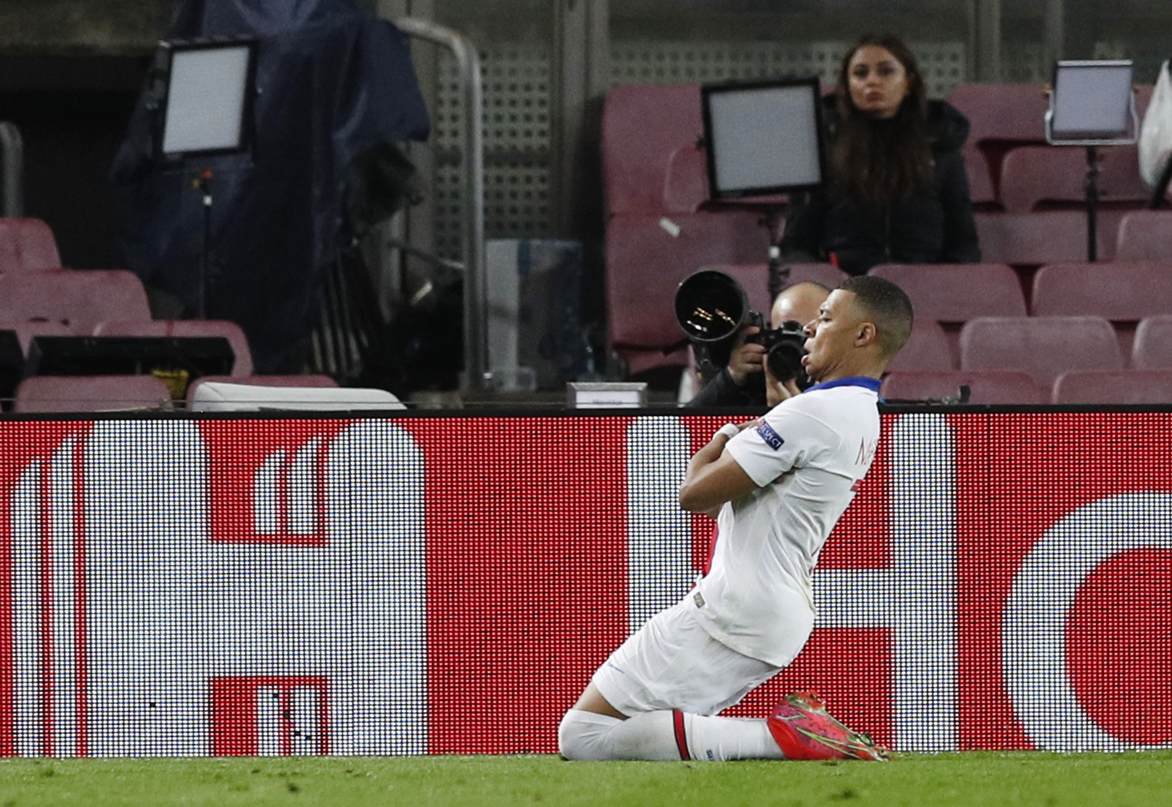 Soccer Football - Champions League - Round of 16 First Leg - FC Barcelona v Paris St Germain - Camp Nou, Barcelona, Spain - February 16, 2021  Paris St Germain's Kylian Mbappe celebrates scoring their first goal REUTERS