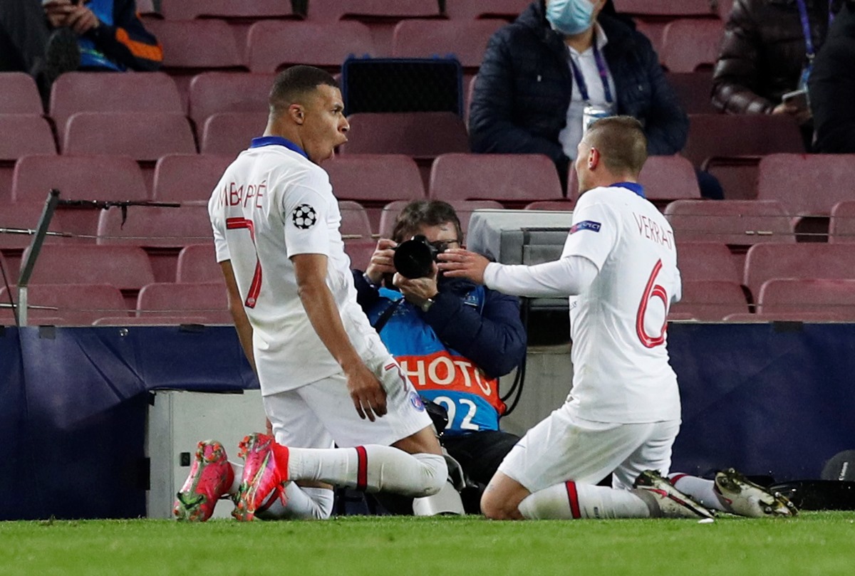 Soccer Football - Champions League - Round of 16 First Leg - FC Barcelona v Paris St Germain - Camp Nou, Barcelona, Spain - February 16, 2021  Paris St Germain's Kylian Mbappe celebrates scoring their first goal REUTERS