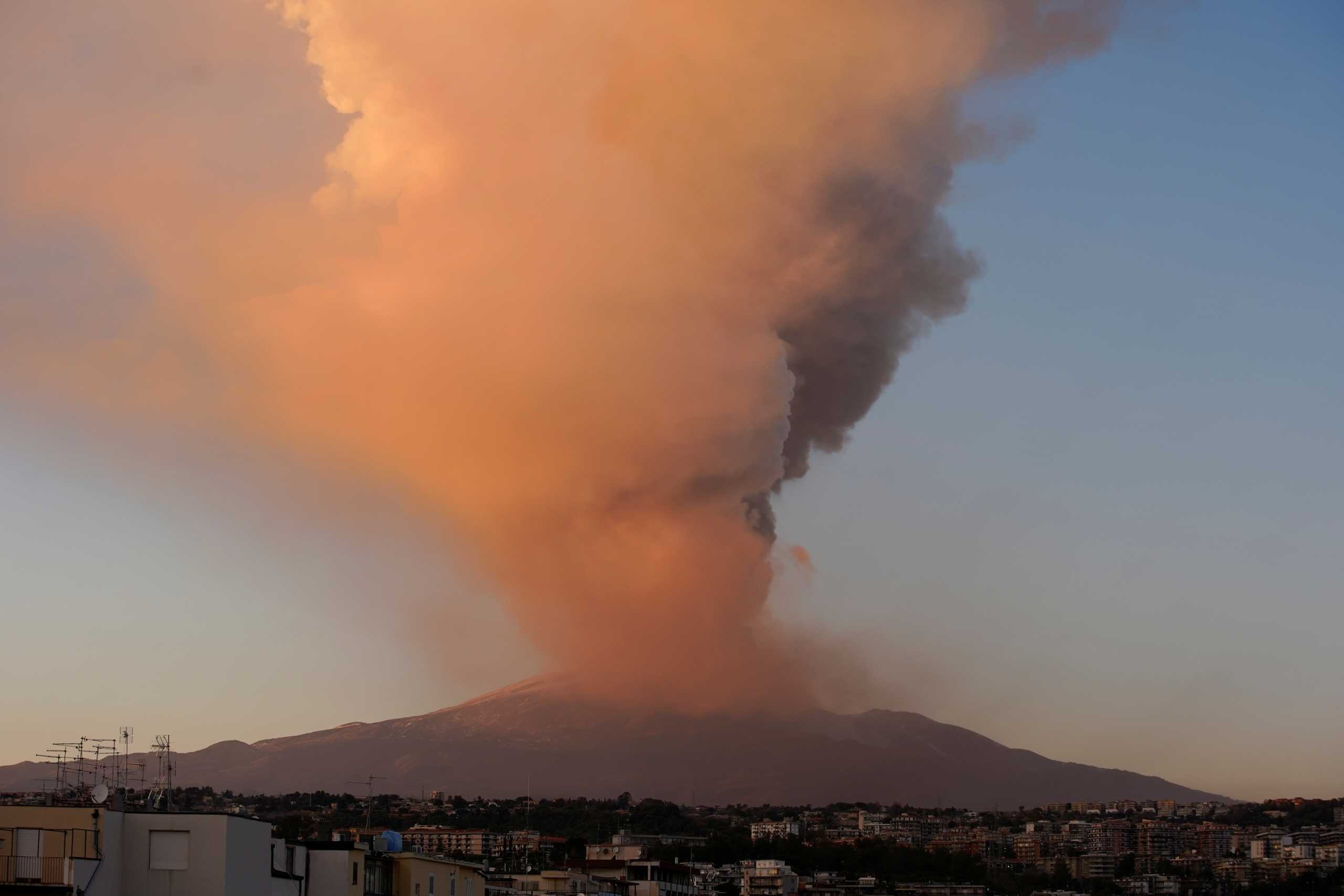 Mount Etna, Europe's most active volcano, spews volcanic ash as it leaps into action, seen from the village of Catania, Italy February 16, 2021. REUTERS