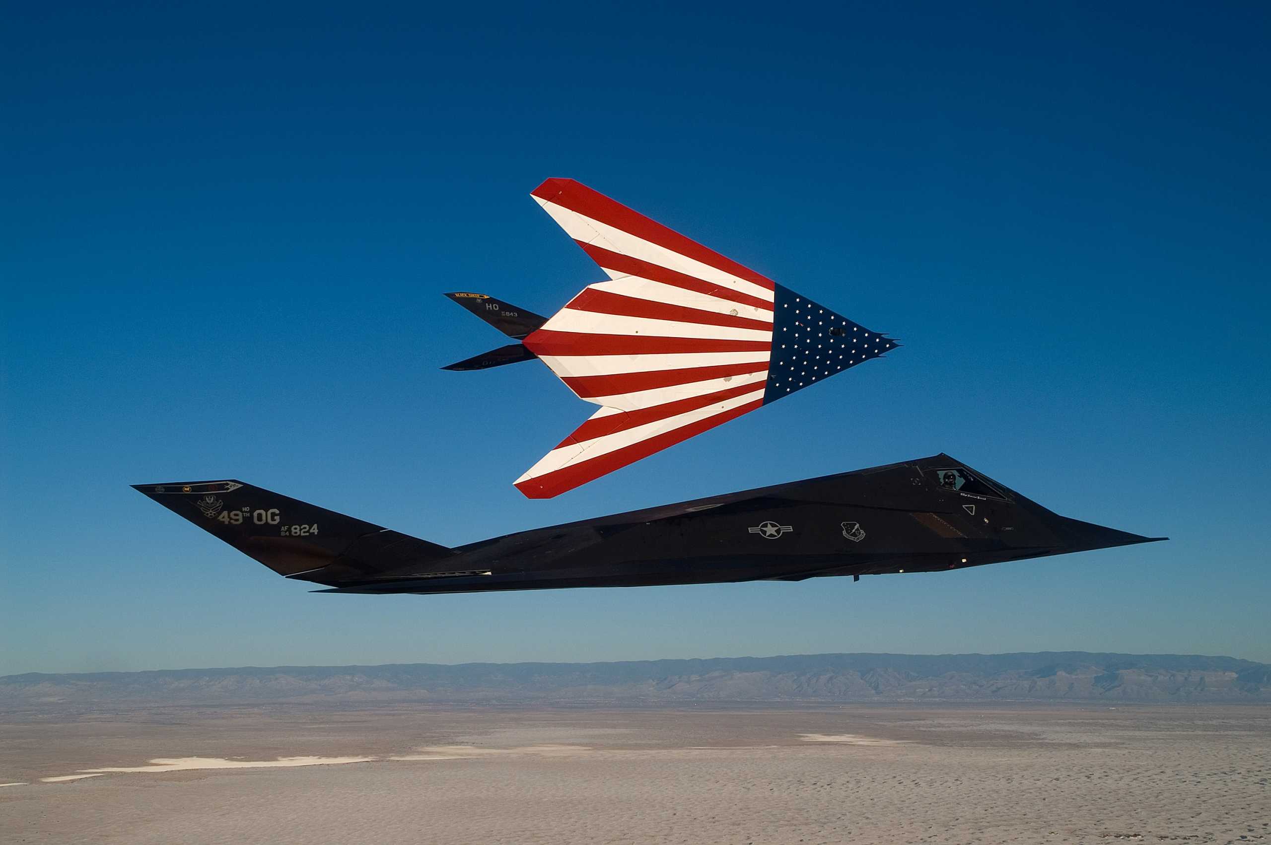Two specially painted F-117 Nighthawks fly on one of their last missions. The F-117s were retired March 11 in a farewell ceremony at Wright-Patterson Air Force Base, Ohio. (U.S. Air Force photo