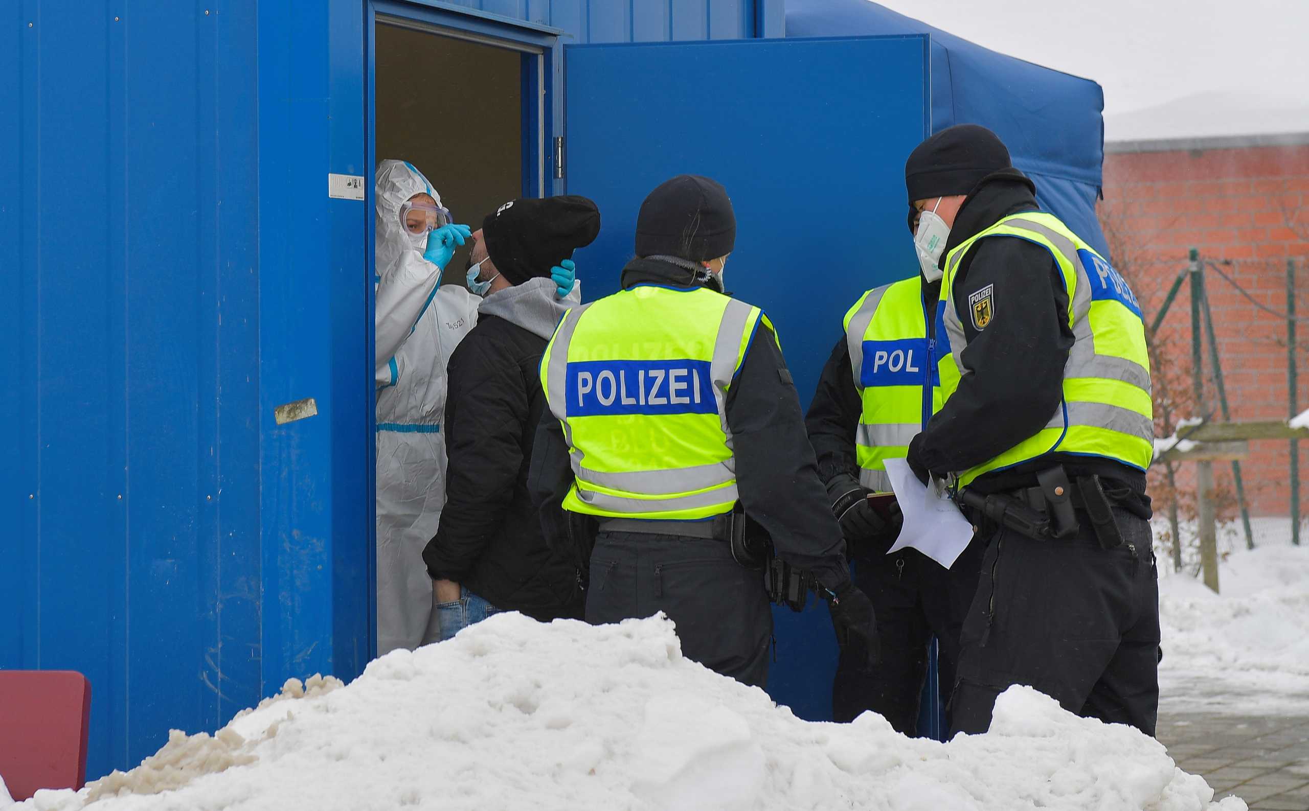 A traveler gets a COVID-19 rapid test near the Czech-German border, after controls between Germany and the Czech Republic have been re-established, as the spread of the coronavirus disease (COVID-19) continues, in Breitenau, Germany, February 15, 2021. REUTERS