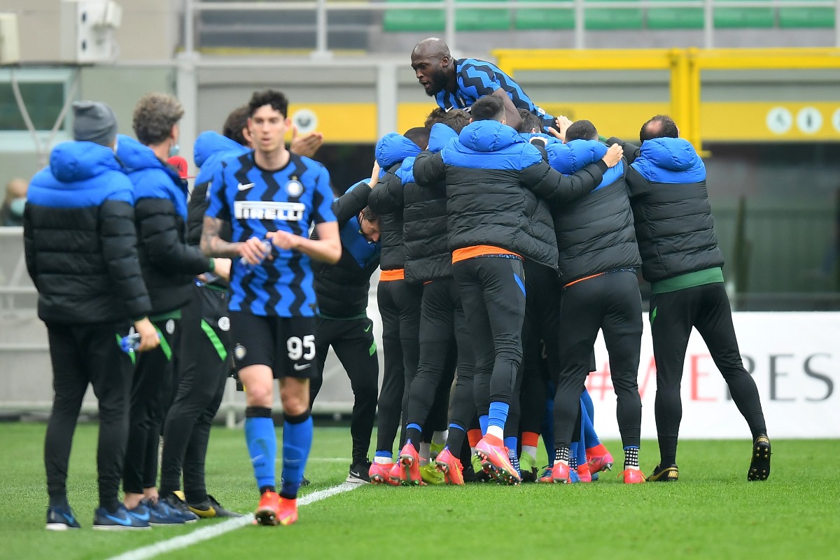 Soccer Football - Serie A - AC Milan v Inter Milan - San Siro, Milan, Italy - February 21, 2021 Inter Milan's Lautaro Martinez celebrates scoring their second goal with Romelu Lukaku and teammates REUTERS