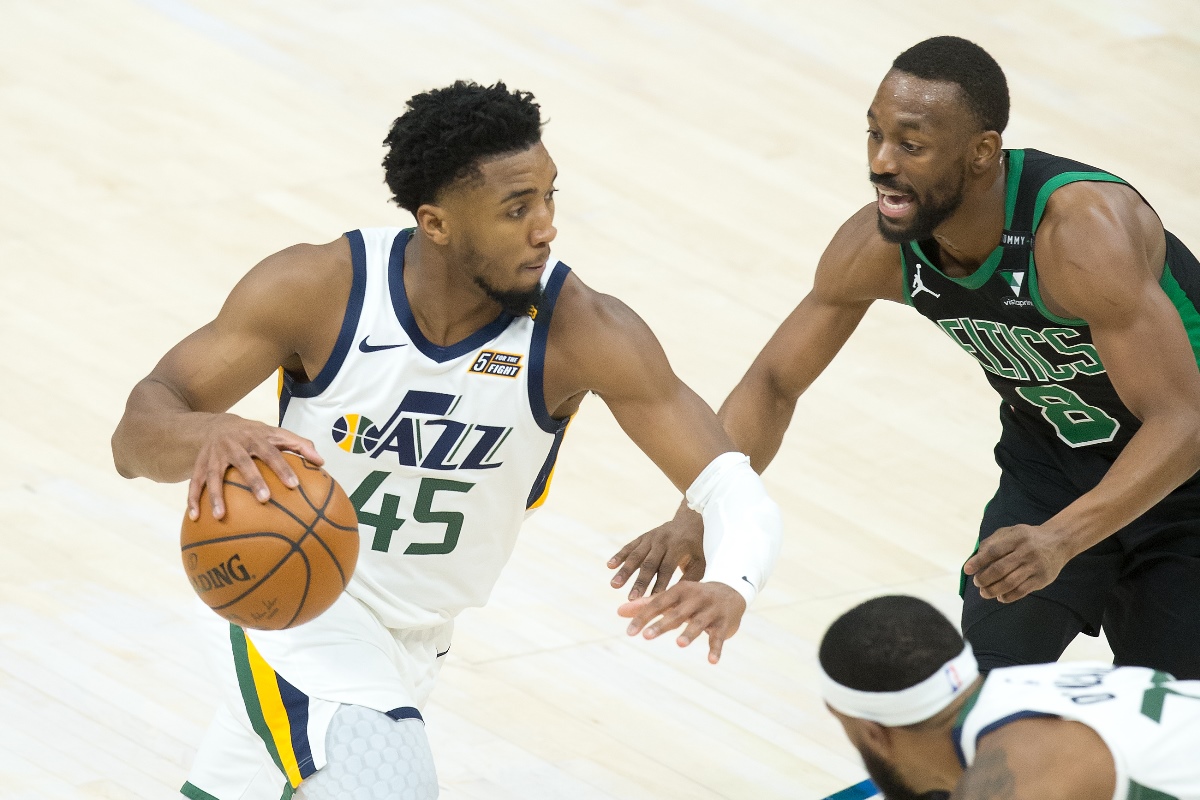 Feb 9, 2021; Salt Lake City, Utah, USA; Utah Jazz guard Donovan Mitchell (45) dribbles the ball against Boston Celtics guard Kemba Walker (8) during the second half at Vivint Smart Home Arena. Mandatory Credit: Russell Isabella-USA TODAY Sports