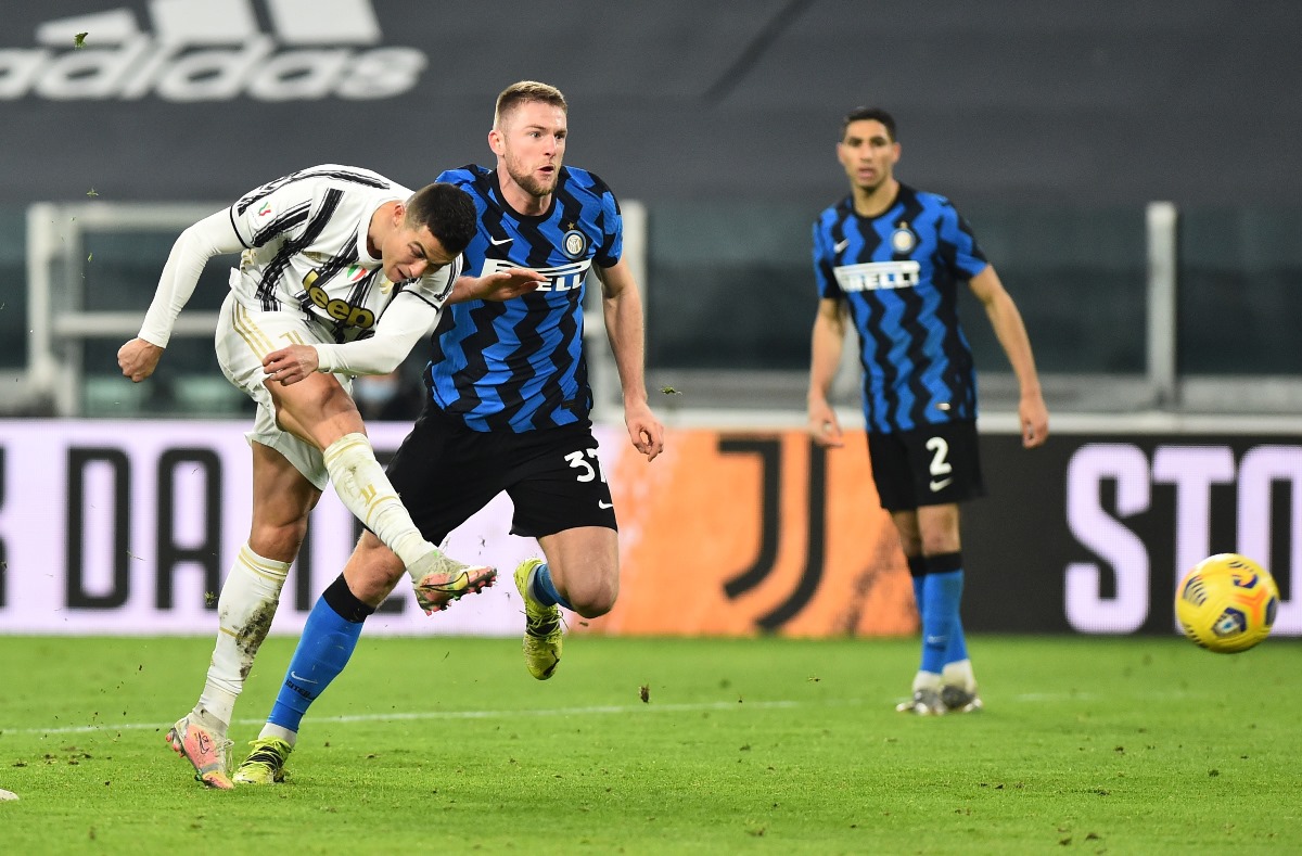 Soccer Football - Coppa Italia - Semi Final Second Leg - Juventus v Inter Milan - Allianz Stadium, Turin, Italy - February 9, 2021 Juventus' Cristiano Ronaldo in action with Inter Milan's Milan Skriniar REUTERS