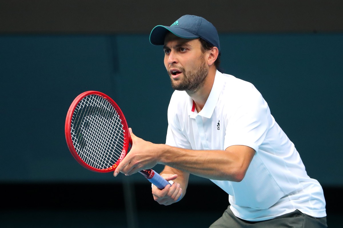 Tennis - Australian Open - Melbourne Park, Melbourne, Australia, February 16, 2021 Russia's Aslan Karatsev in action during his quarter final match against Bulgaria's Grigor Dimitrov REUTERS