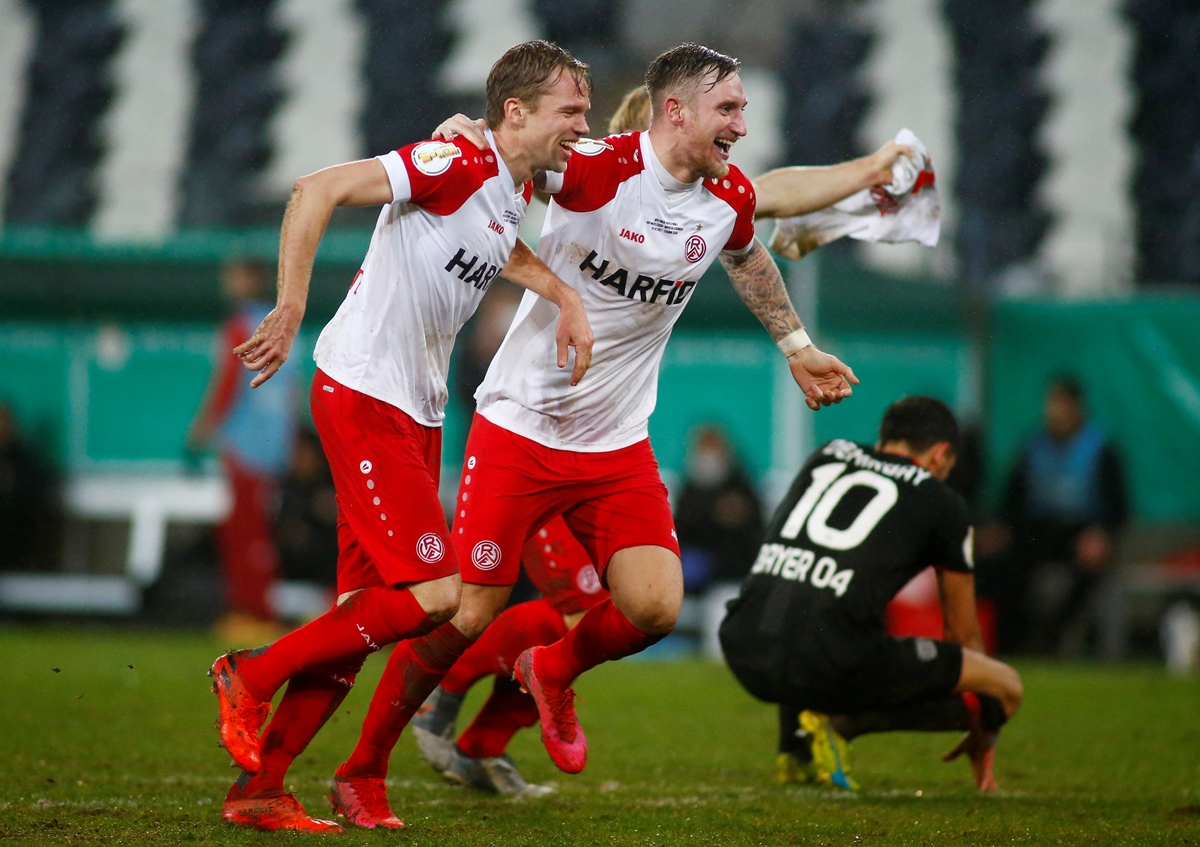 Soccer Football - DFB Cup - Third Round - Essen v Bayer Leverkusen - Stadion Essen, Essen, Germany - February 2, 2021  Essen's Alexander Hahn celebrates winning after the match with teammates Pool via REUTERS