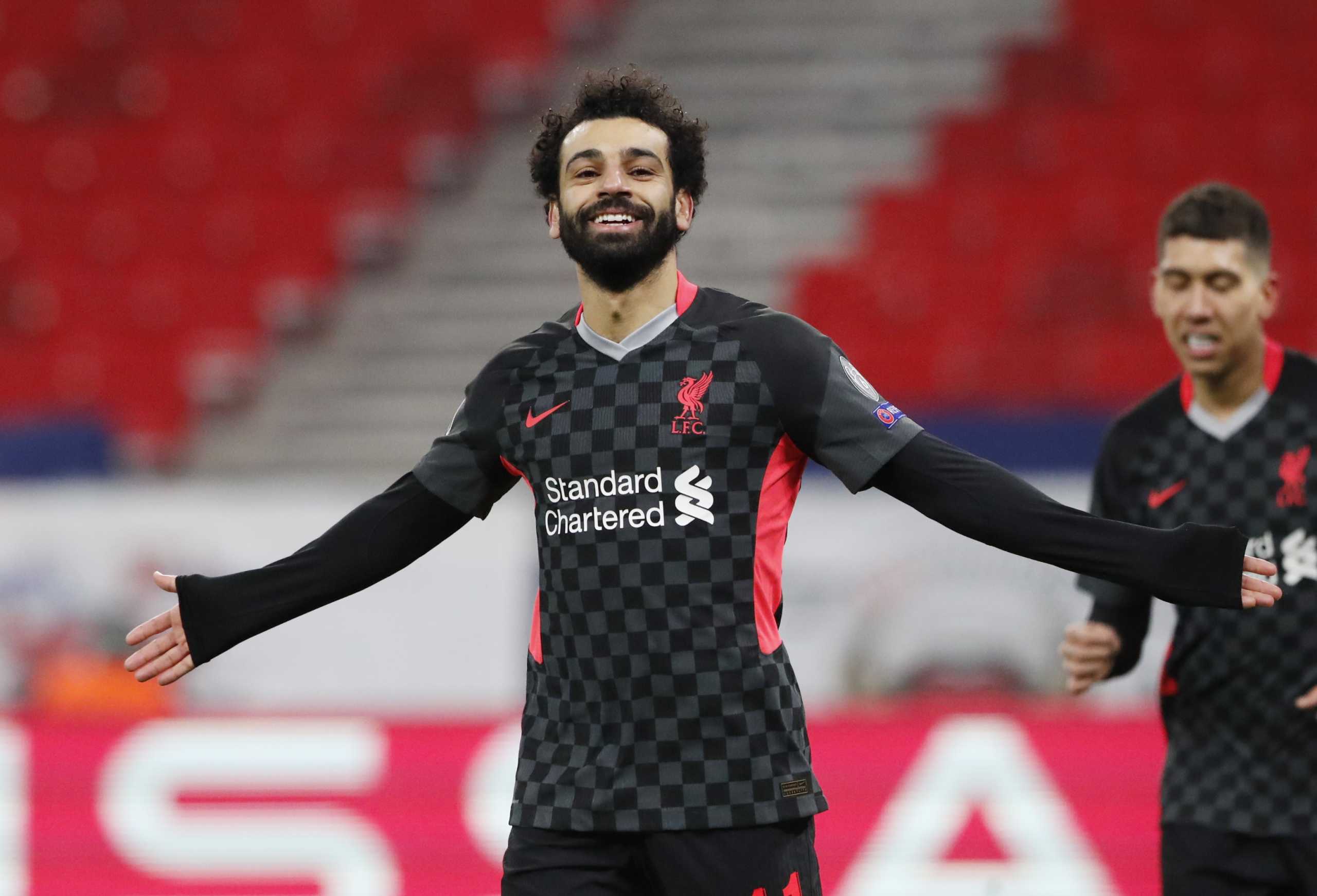 Soccer Football - Champions League - Round of 16 First Leg - RB Leipzig v Liverpool - Puskas Arena, Budapest, Hungary - February 16, 2021 Liverpool's Mohamed Salah celebrates scoring their first goal REUTERS