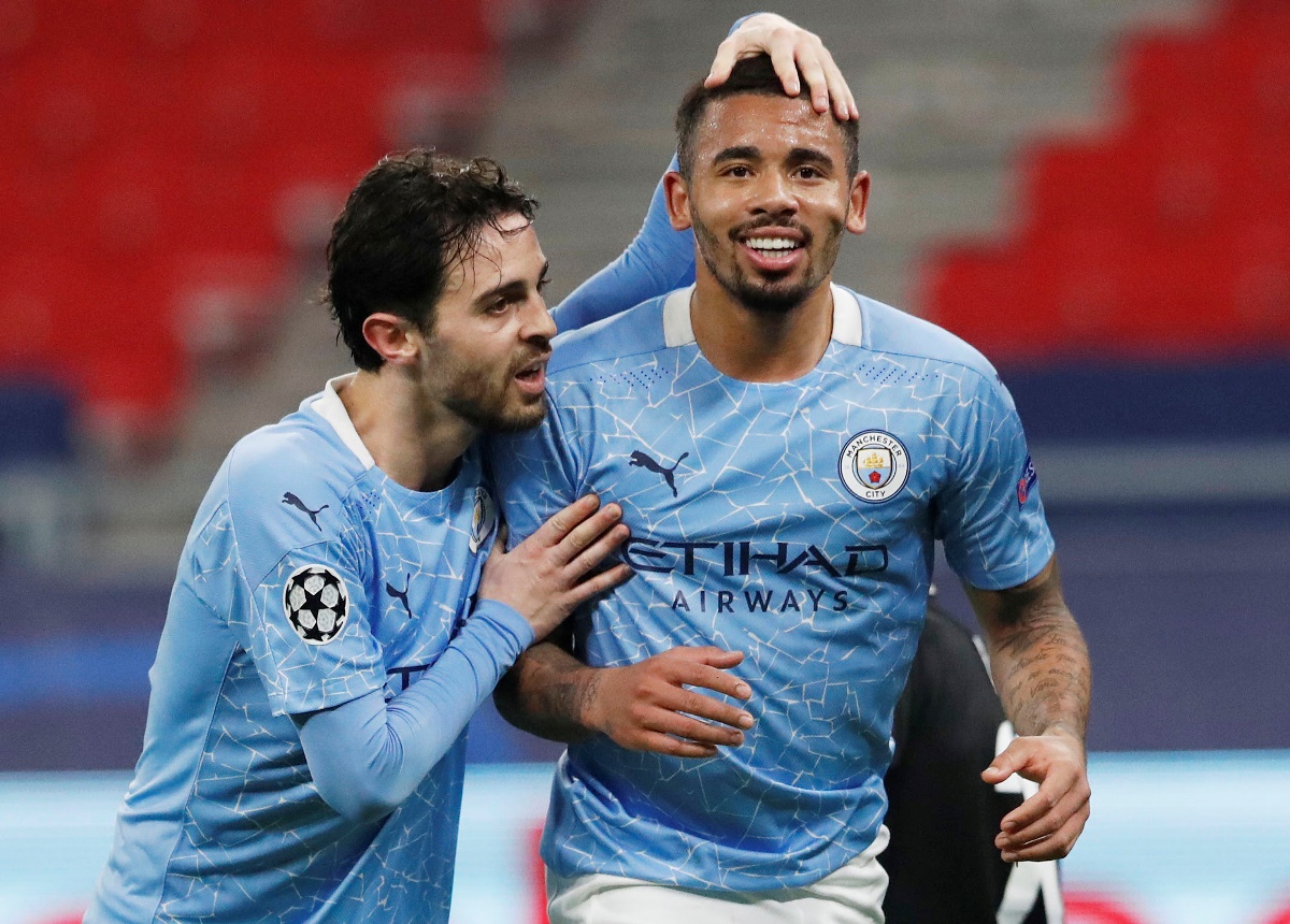 Soccer Football - Champions League - Round of 16 First Leg - Borussia Moenchengladbach v Manchester City - Puskas Arena, Budapest, Hungary - February 24, 2021  Manchester City's Gabriel Jesus celebrates scoring their second goal with Bernardo Silva REUTERS