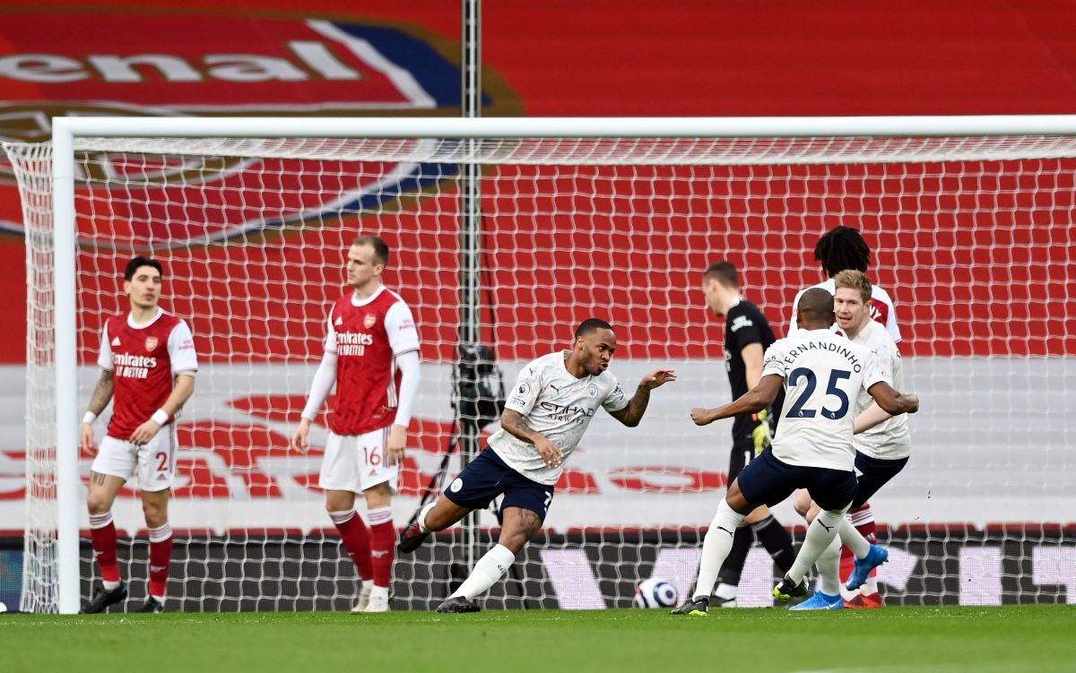 Soccer Football - Premier League - Arsenal v Manchester City - Emirates Stadium, London, Britain - February 21, 2021  Manchester City's Raheem Sterling celebrates scoring their first goal Pool via REUTERS