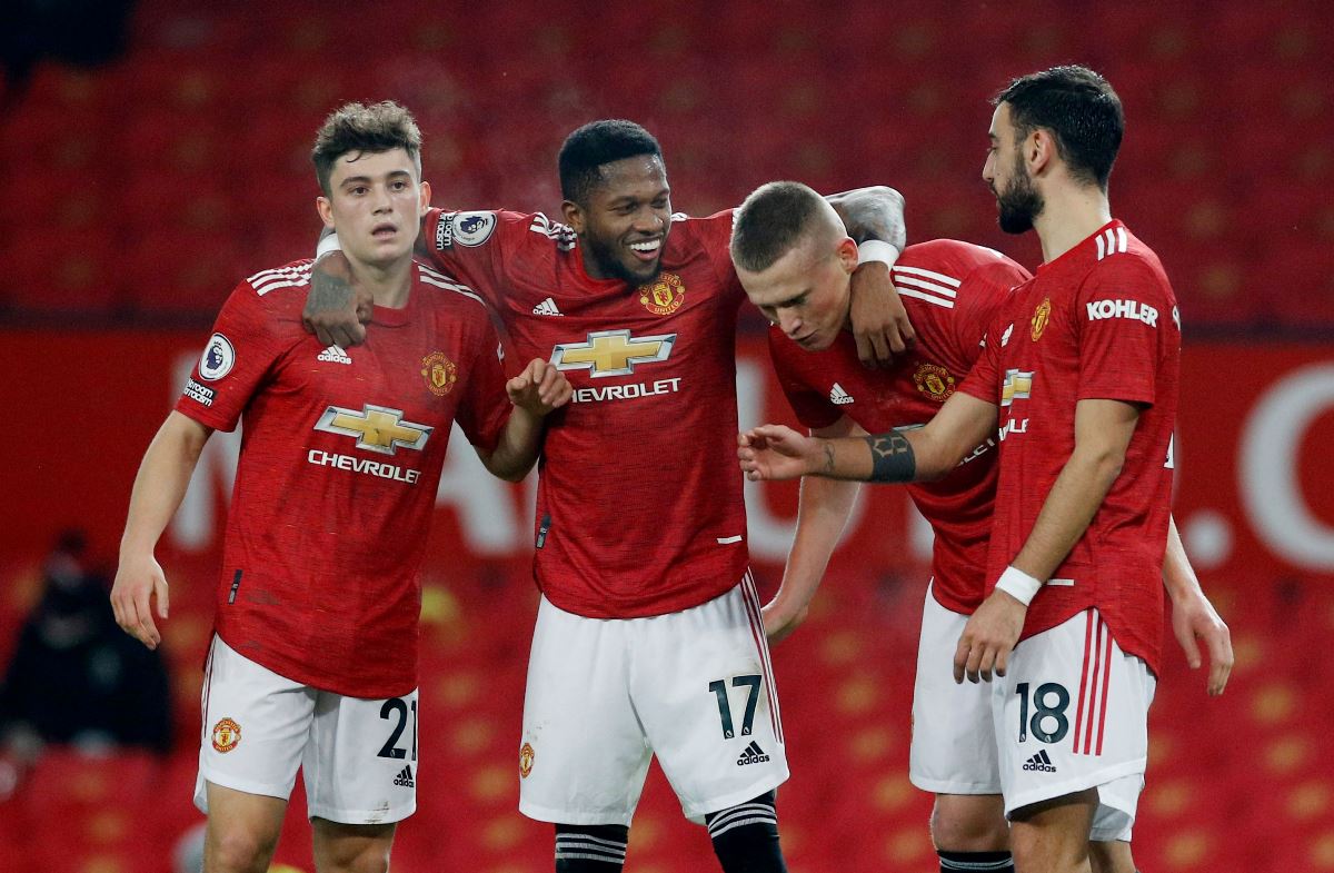 Soccer Football - Premier League - Manchester United v Southampton - Old Trafford, Manchester, Britain - February 2, 2021 Manchester United's Scott McTominay celebrates scoring their sixth goal with teammates Pool via REUTERS